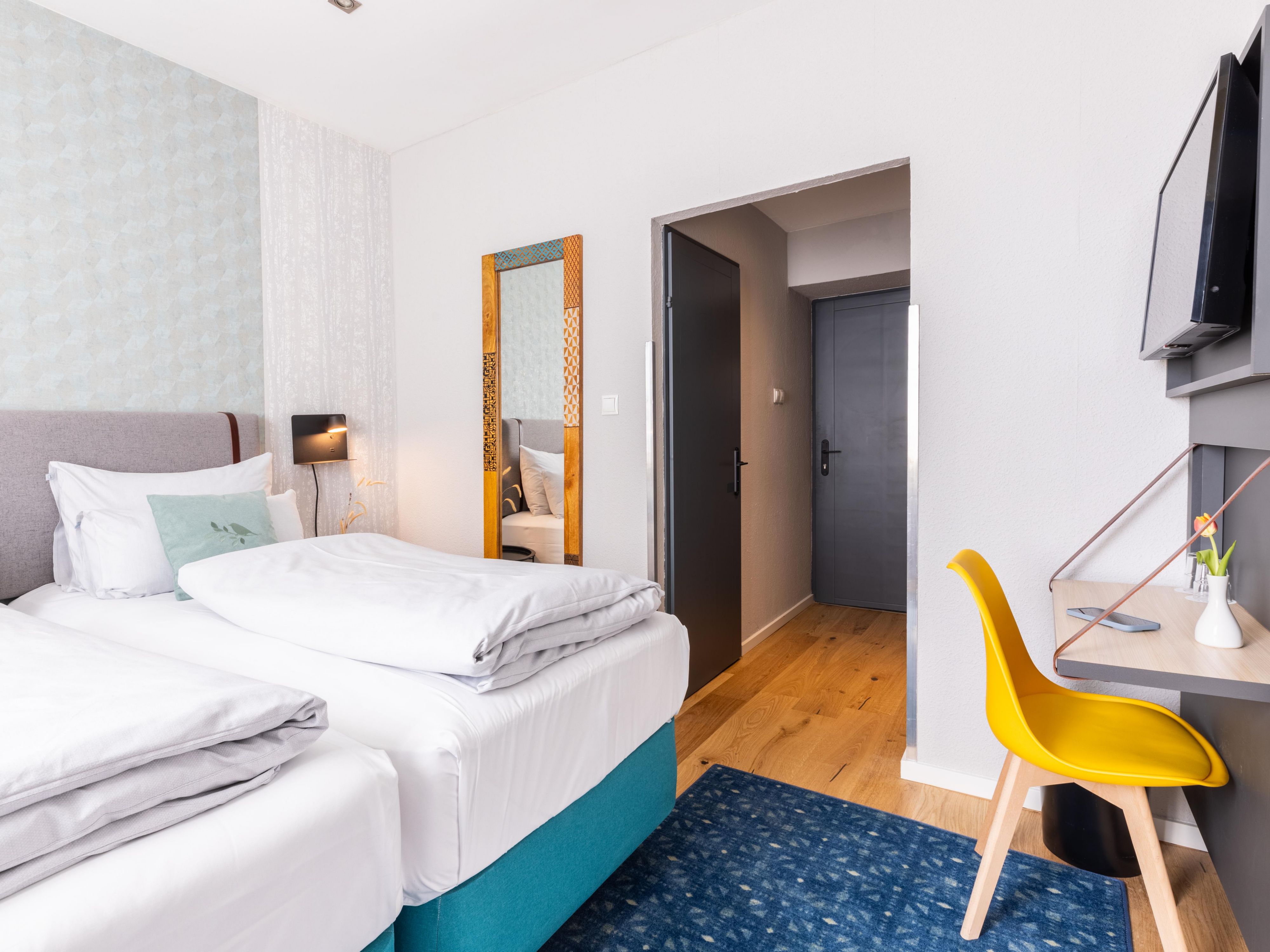 Modern guest rooms filled with natural daylight in Vienna