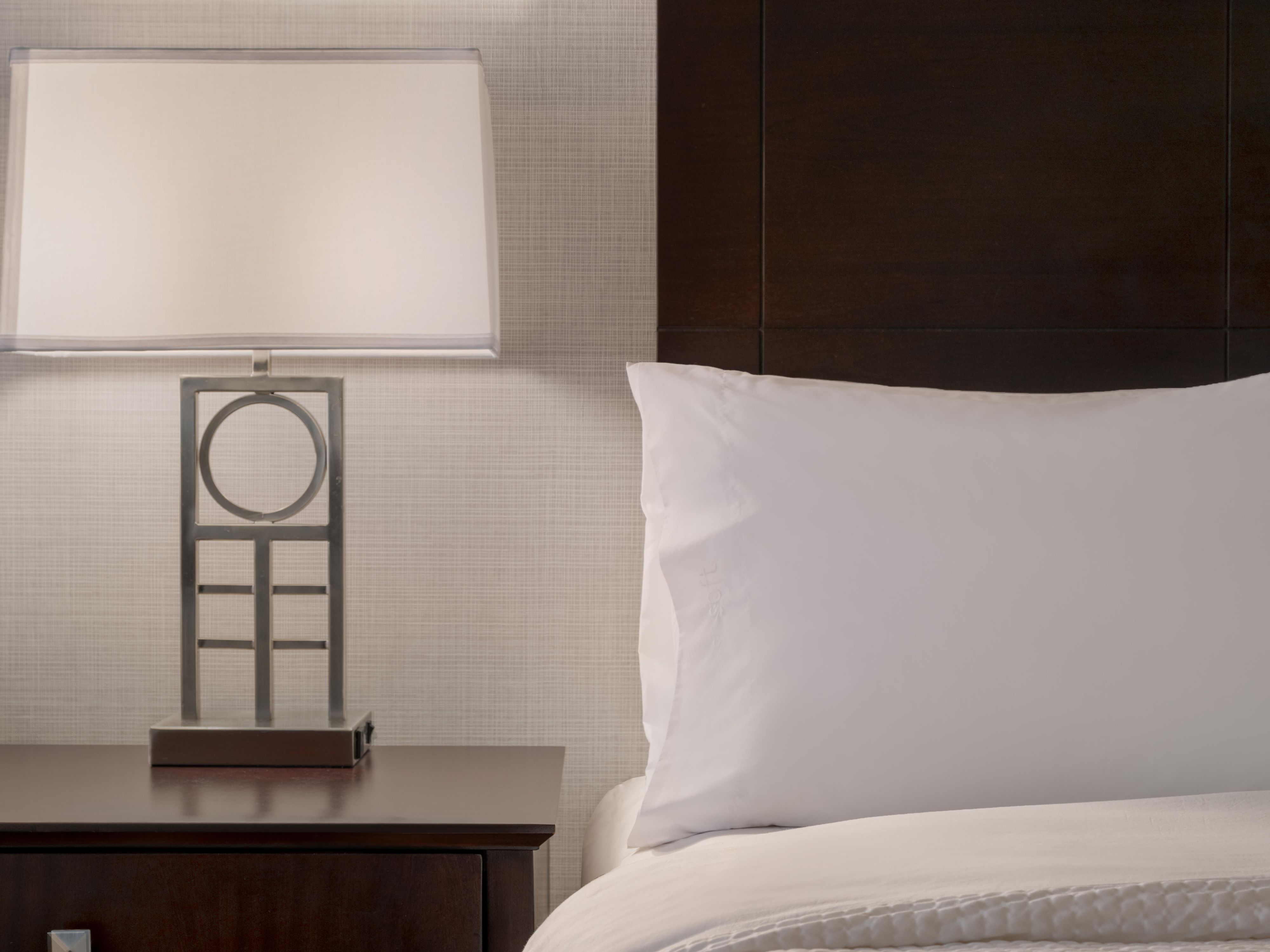 Rest easy in our cozy rooms with plush bedding