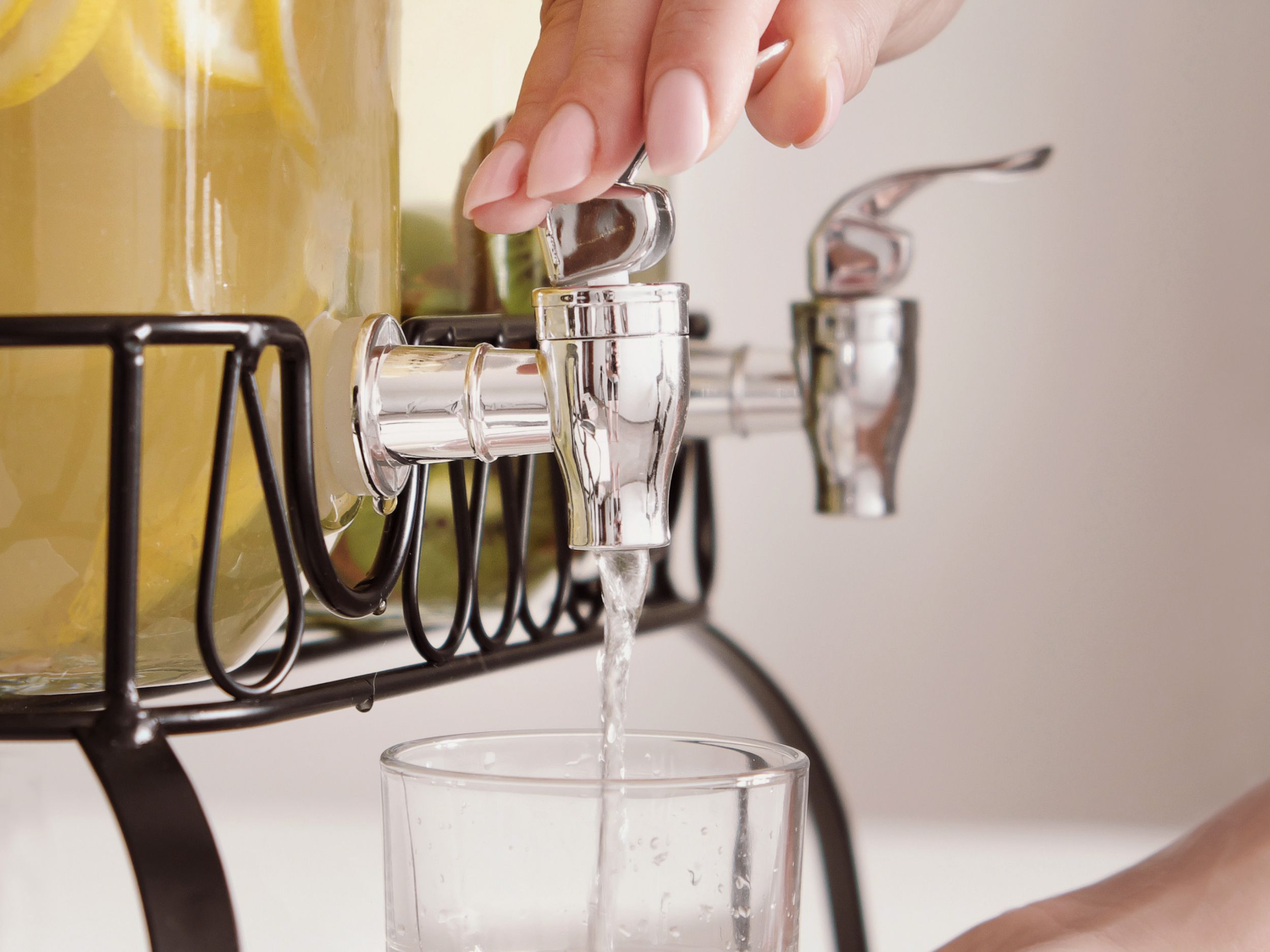 Lemonade being poured into a clear glass