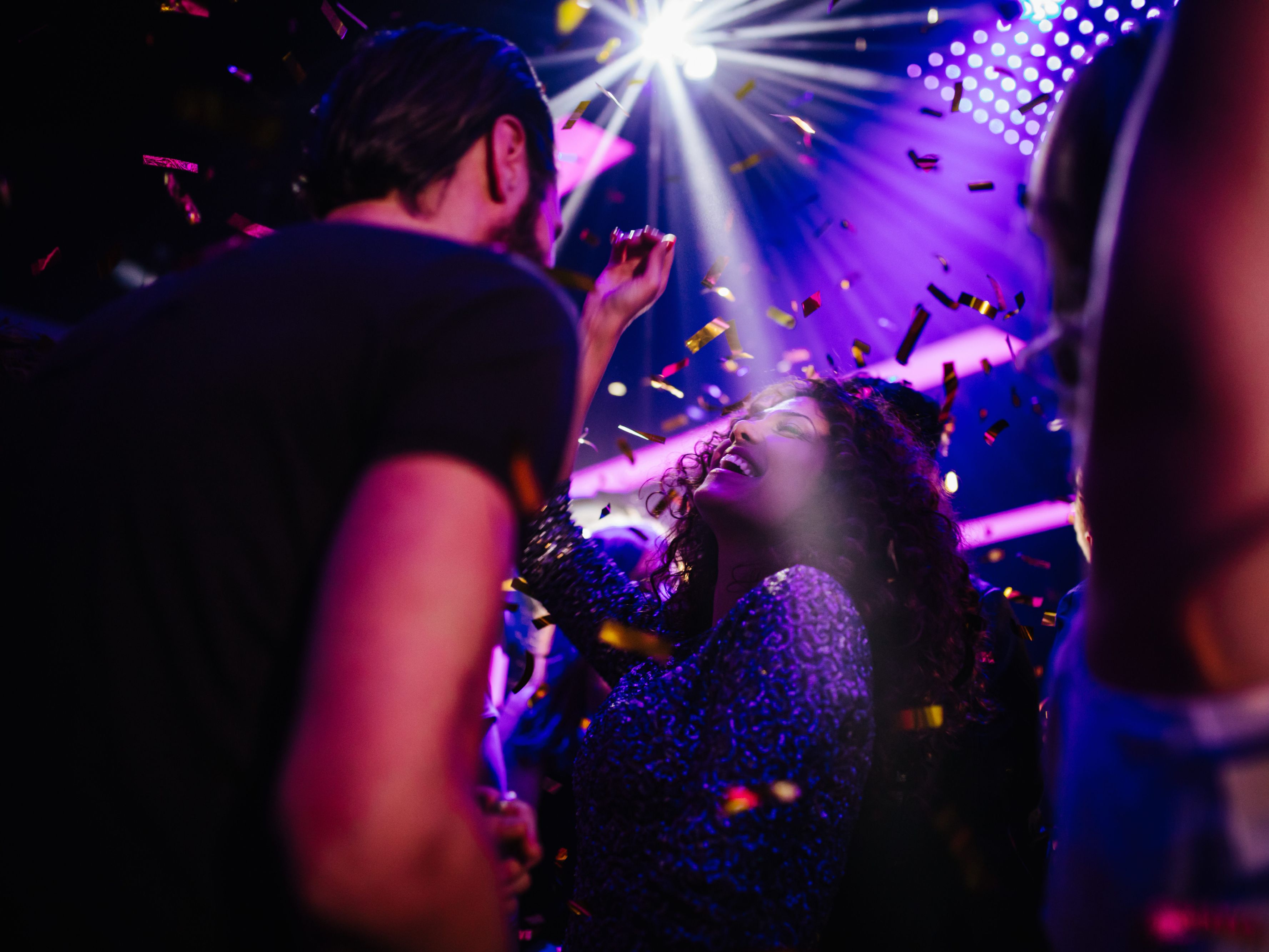 Friends dancing on light up dance floor