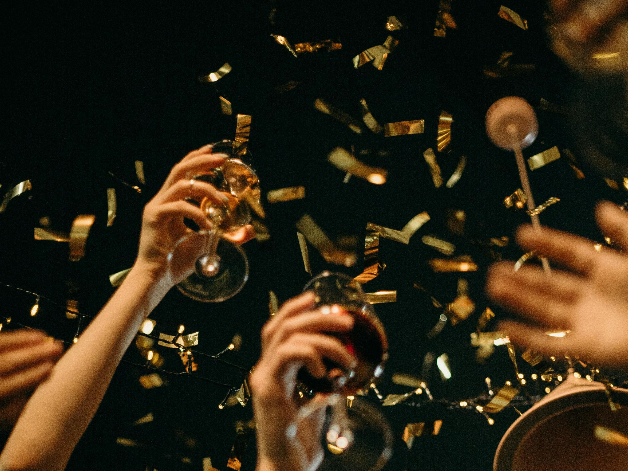 champagne toast with confetti