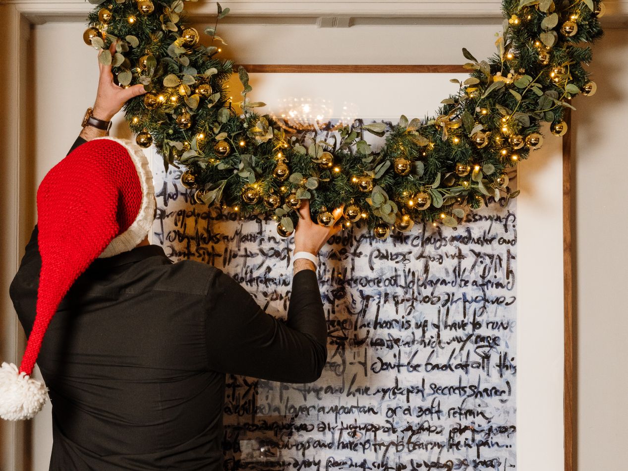 Employee setting up Christmas decorations