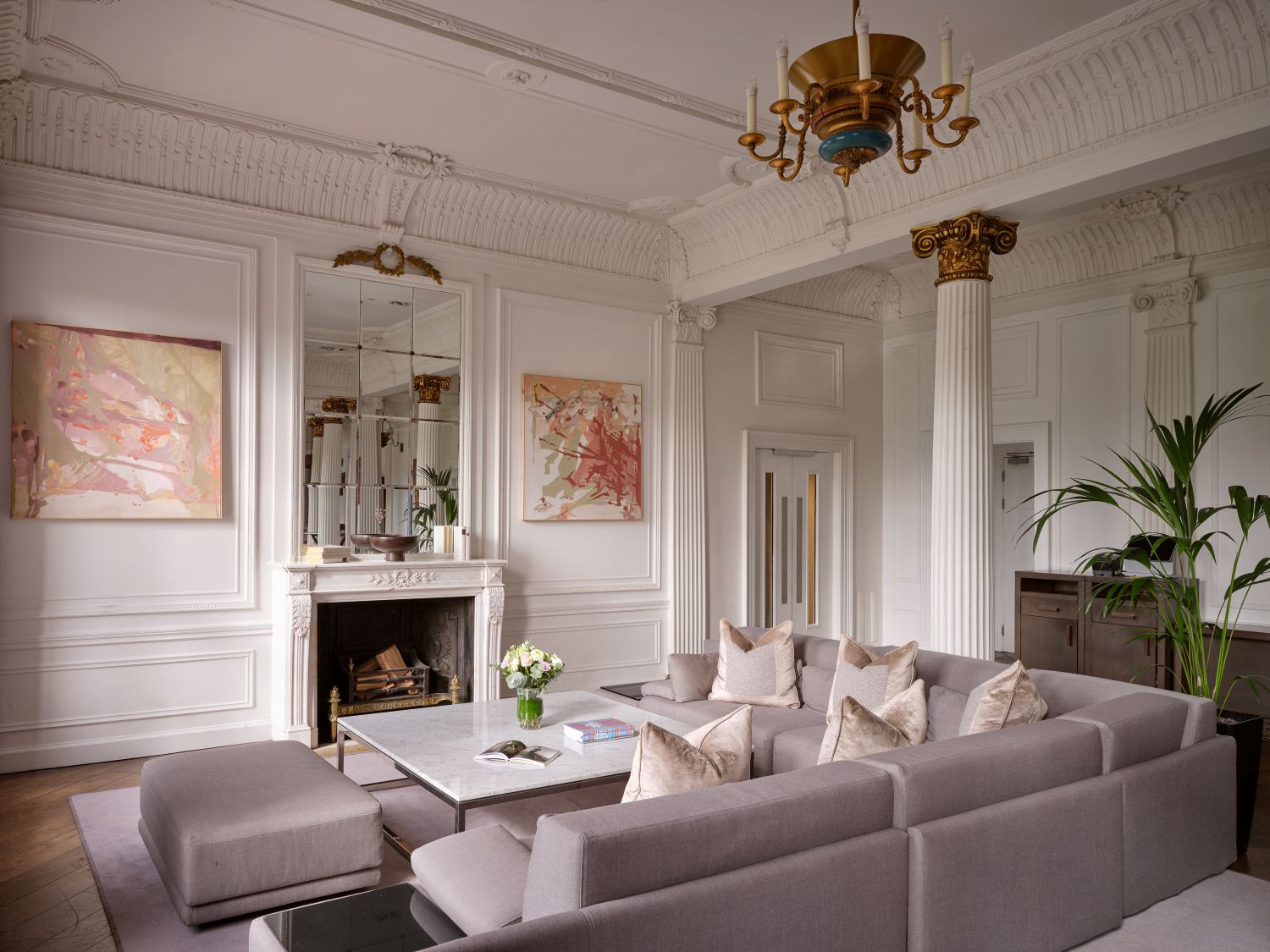 Large seating area with cosy sofas, armchairs and large windows