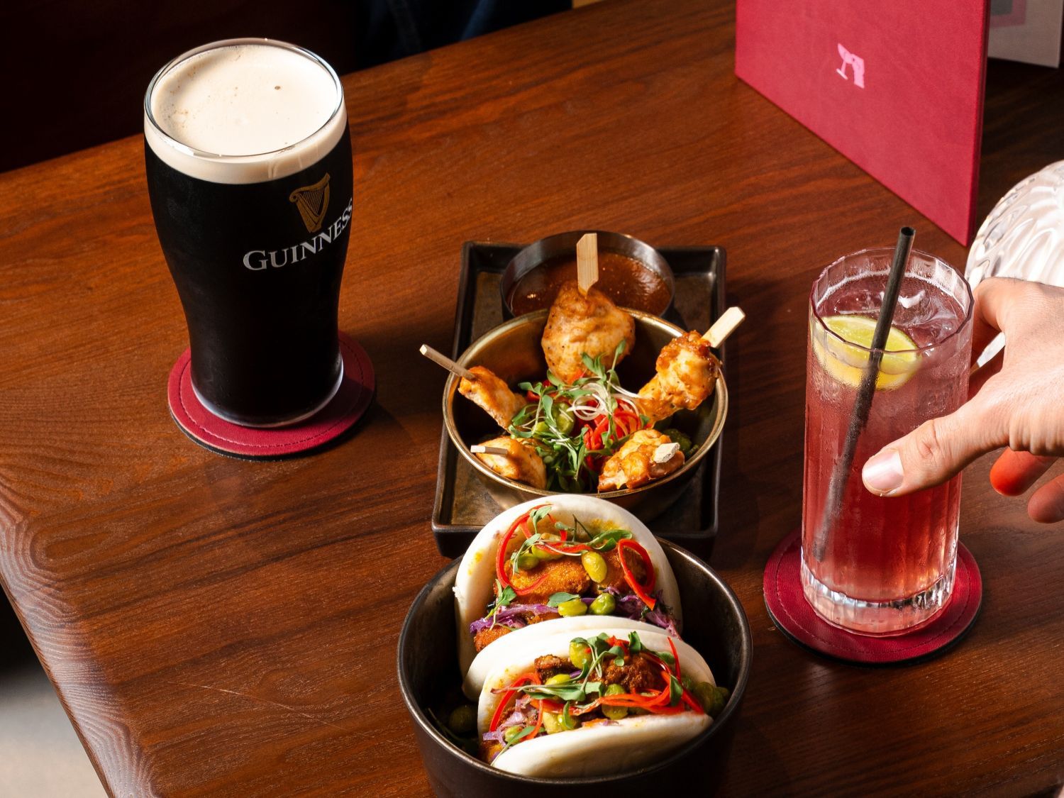 bao buns, Guinness and a pink cocktail