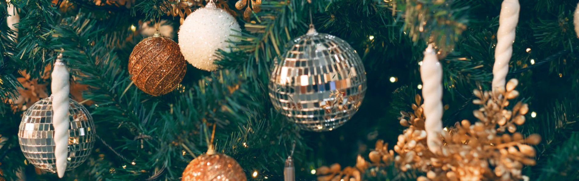 christmas tree decorated with disco balls and gold baubles