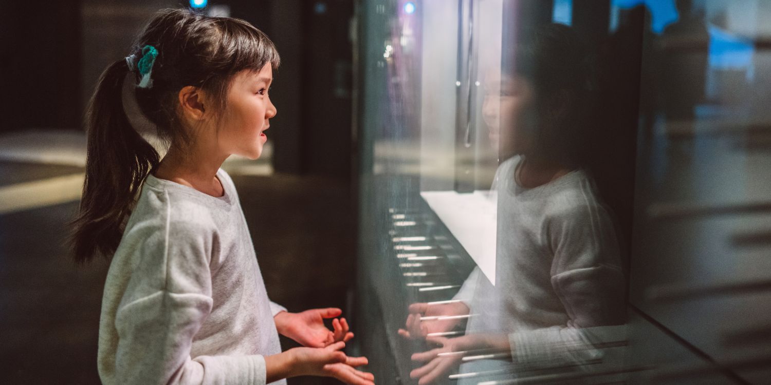 a young girl fascinated in a museum