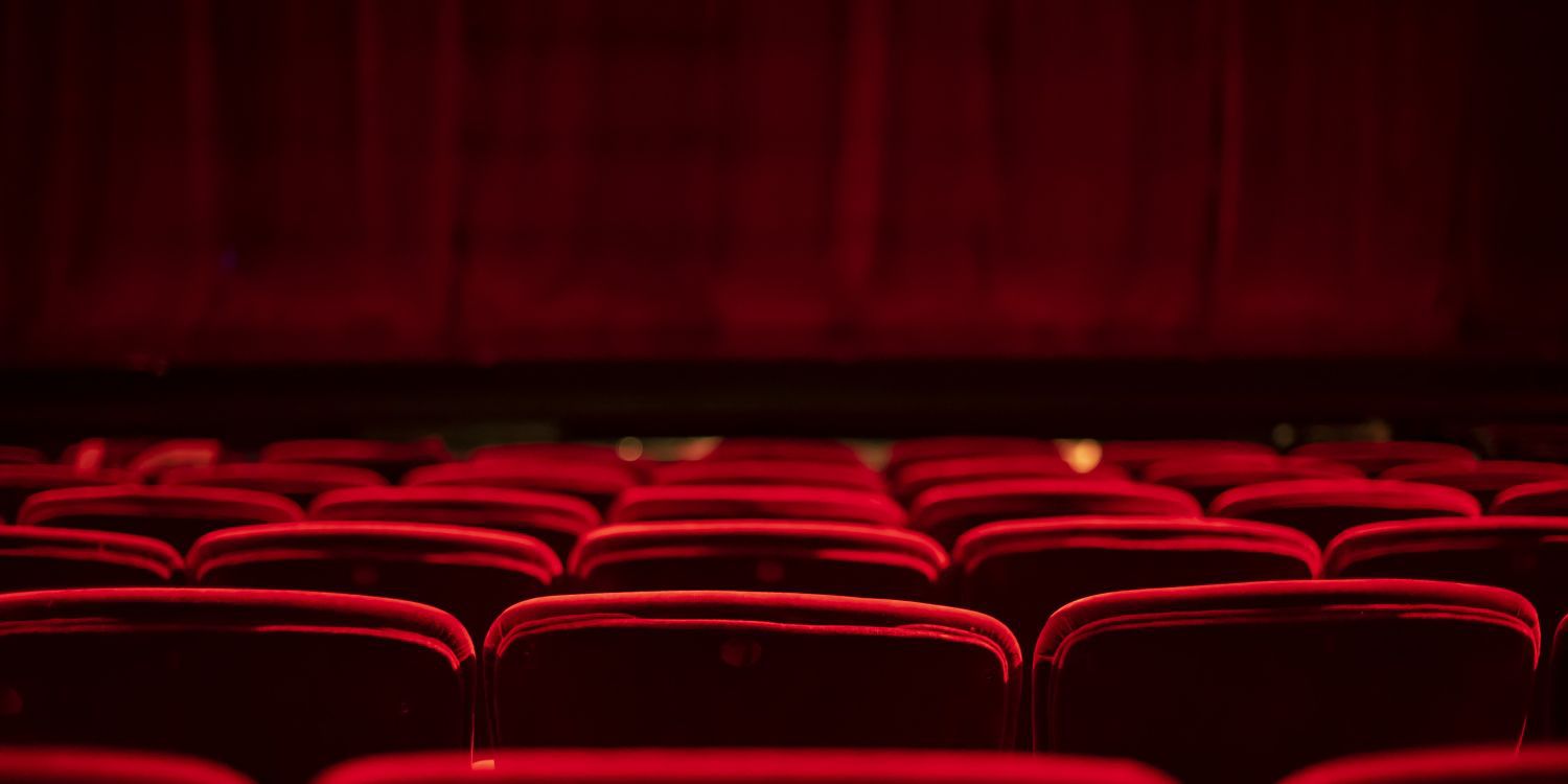 theatre with red seats and stage