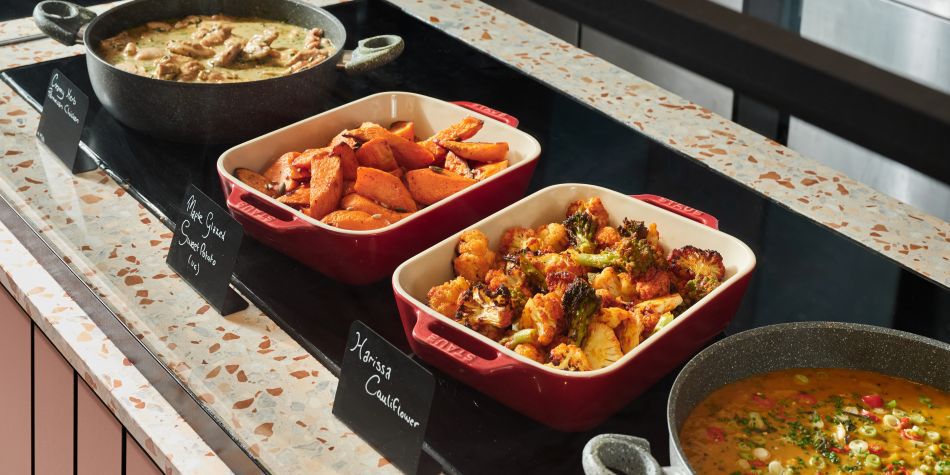 selection of hot dishes such as harissa cauliflower and sweet potato