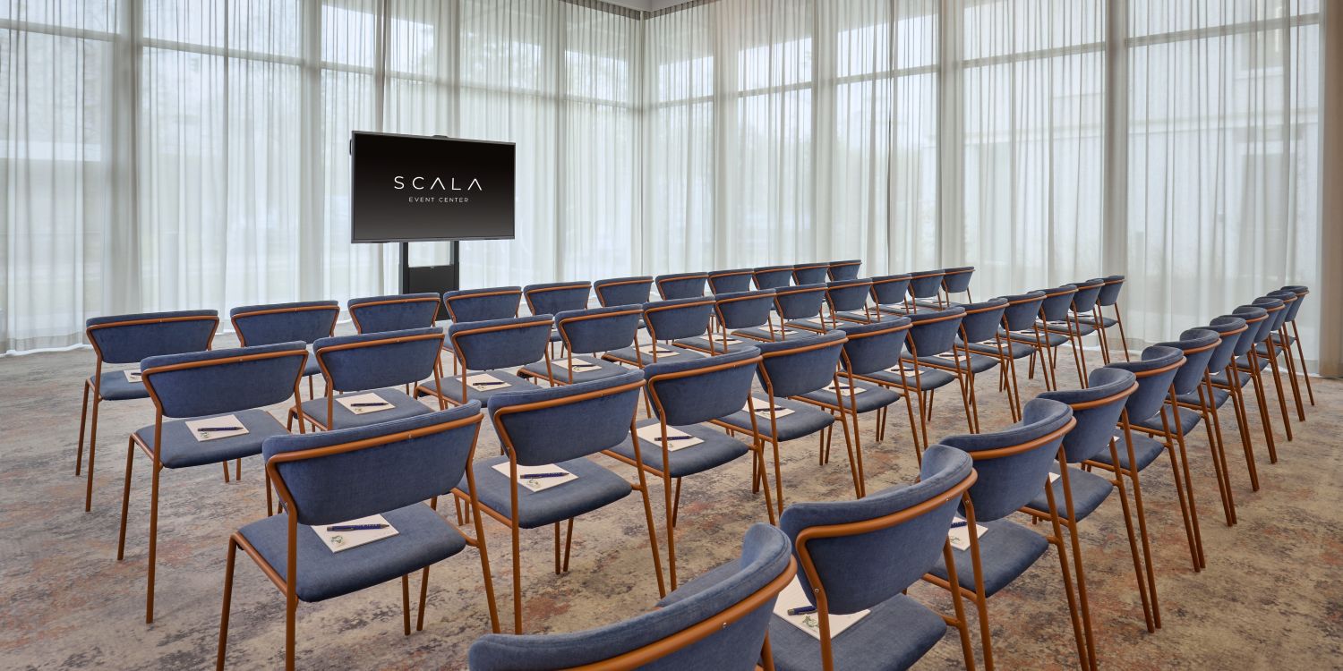 bright lit meeting room with screen