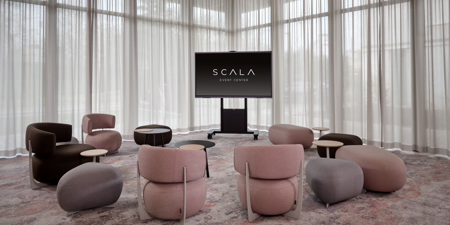 cosy meeting seating area with pink chairs