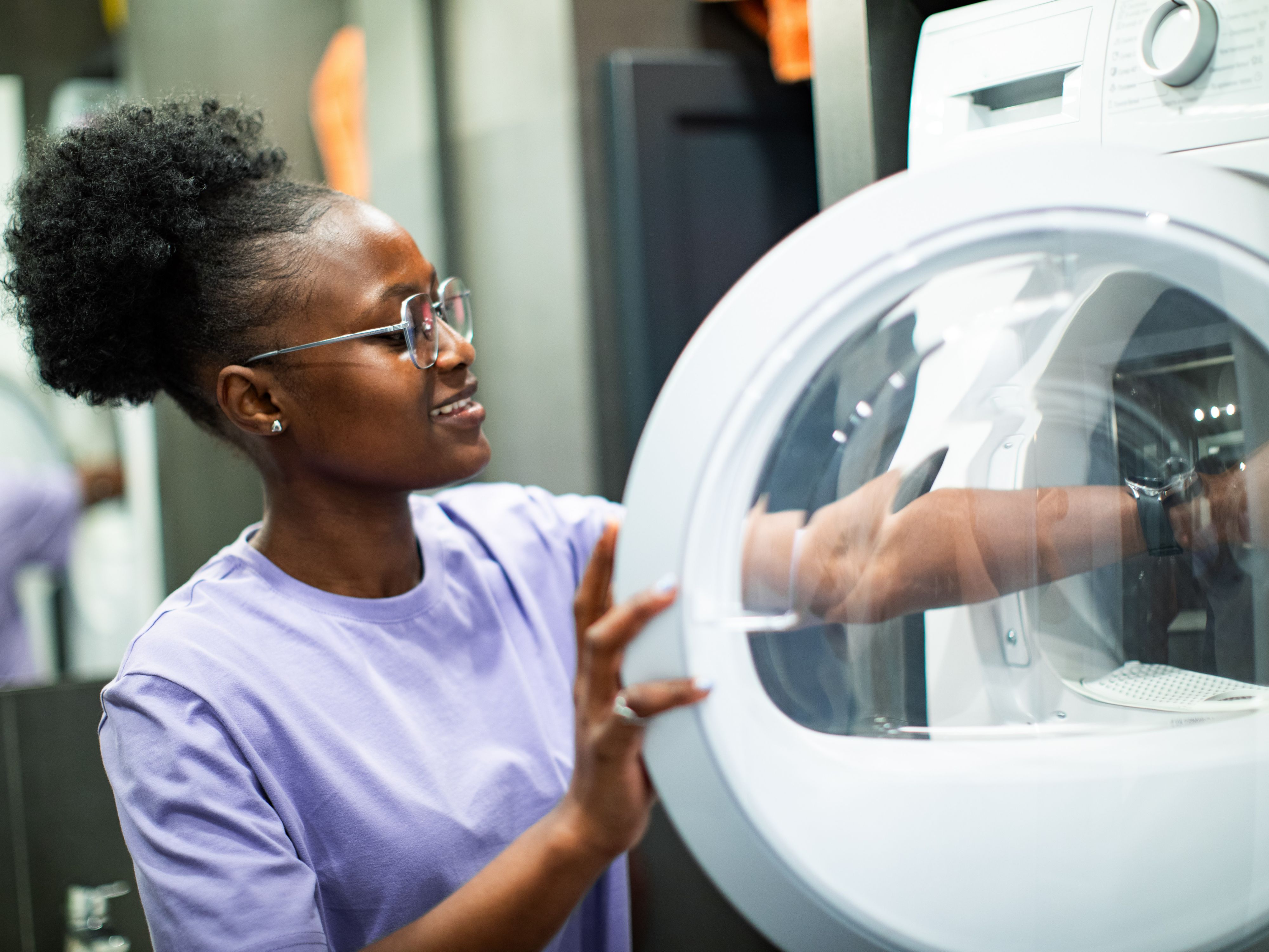Hotel guest using complimentary laundry room