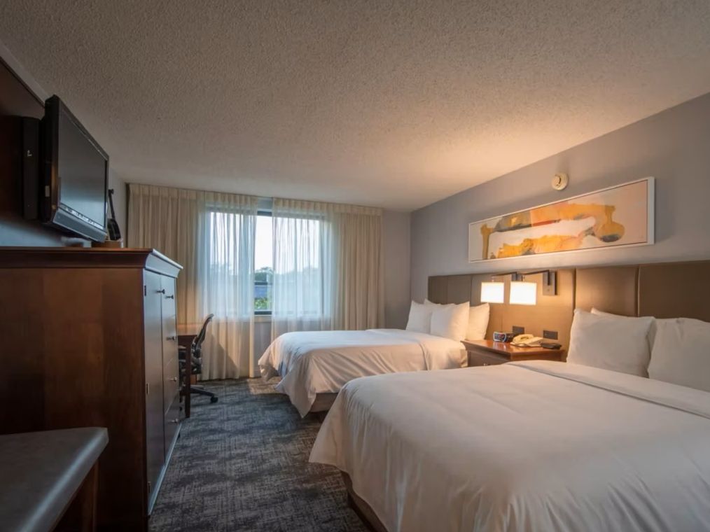 Two Queen bedroom at Crowne Plaza Chicago-Northbrook with plenty of storage and TV
