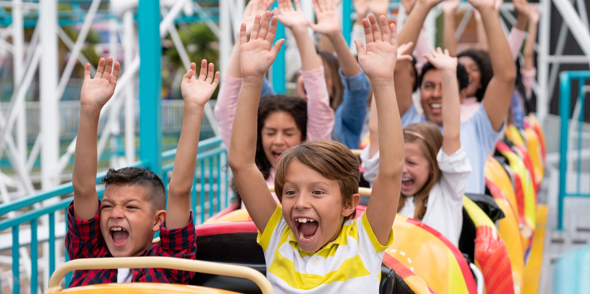Hands up on a roller coaster having fun!