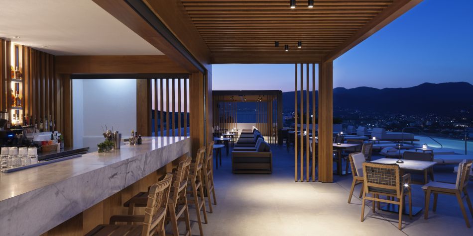 evening at minoan with plenty outdoor terrace seating and wooden panel interiors
