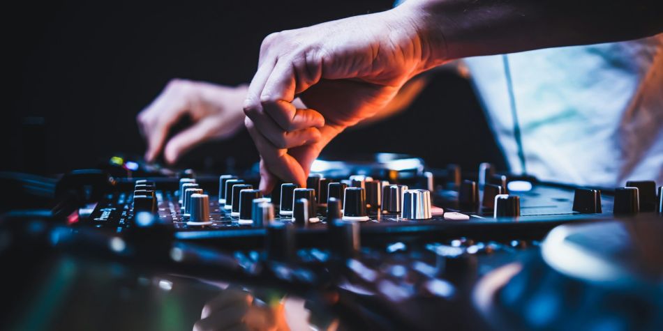 dj playing on the dj decks
