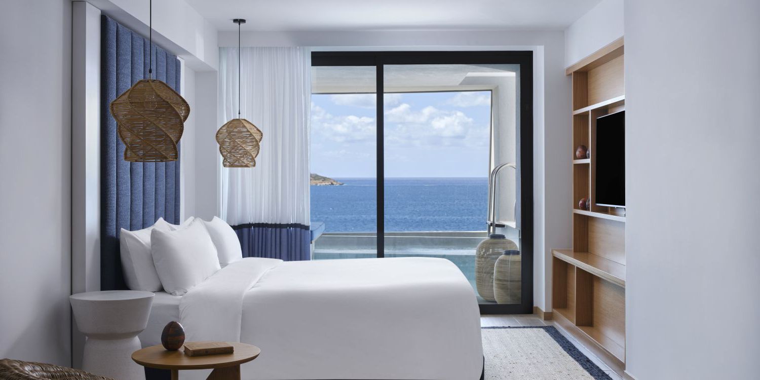 one bedroom suite with view of a private plunge pool and the Cretan Ocean
