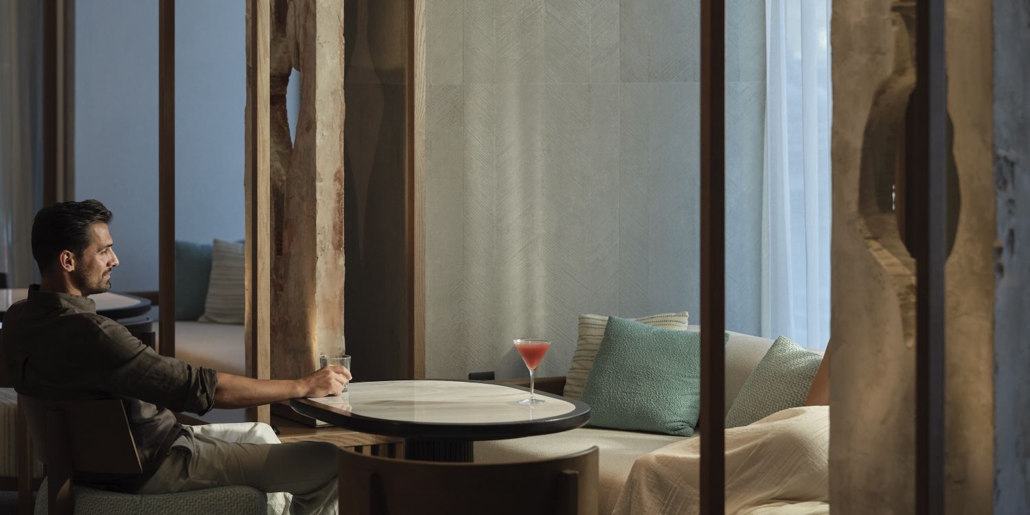 couple sitting a enjoying cocktails in the lounge