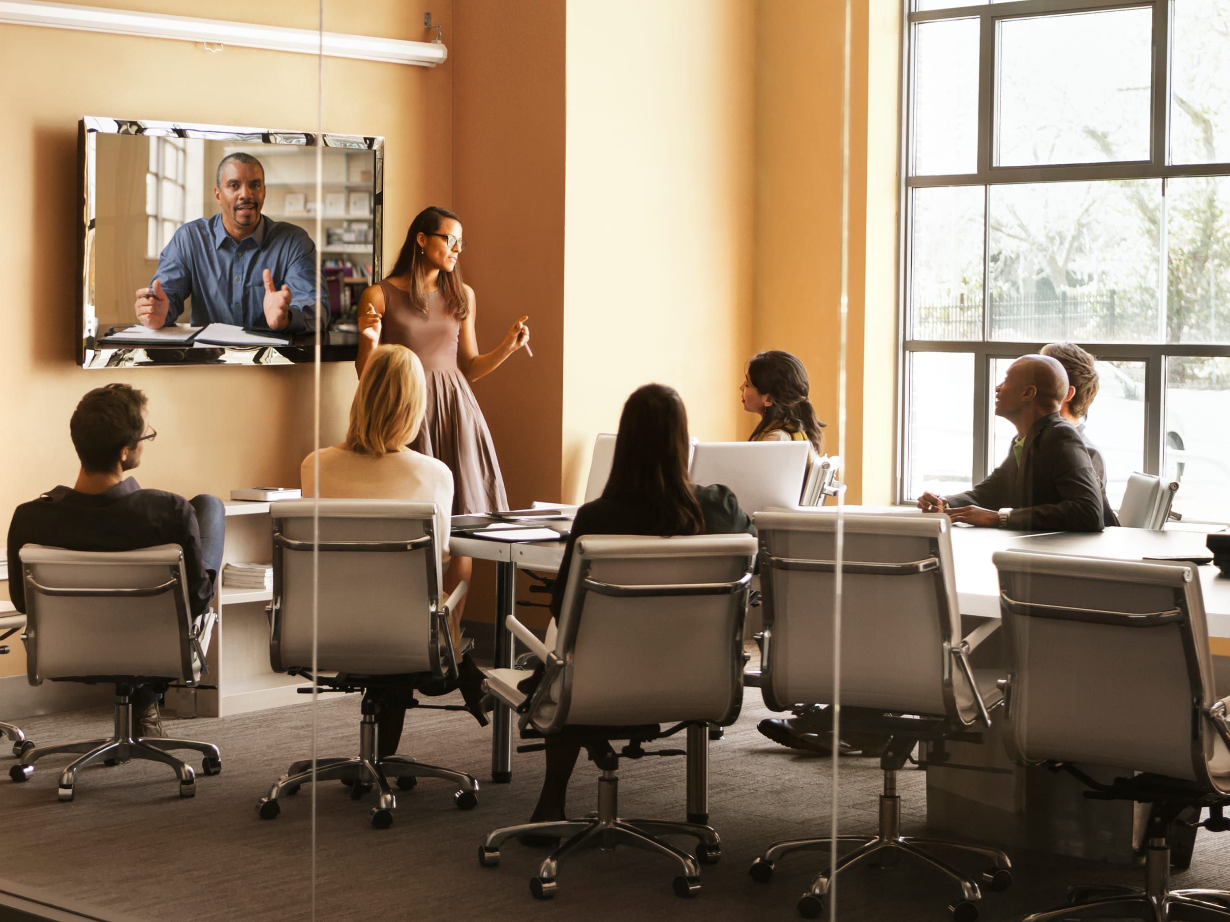 Hybrid meeting happening in large conference room