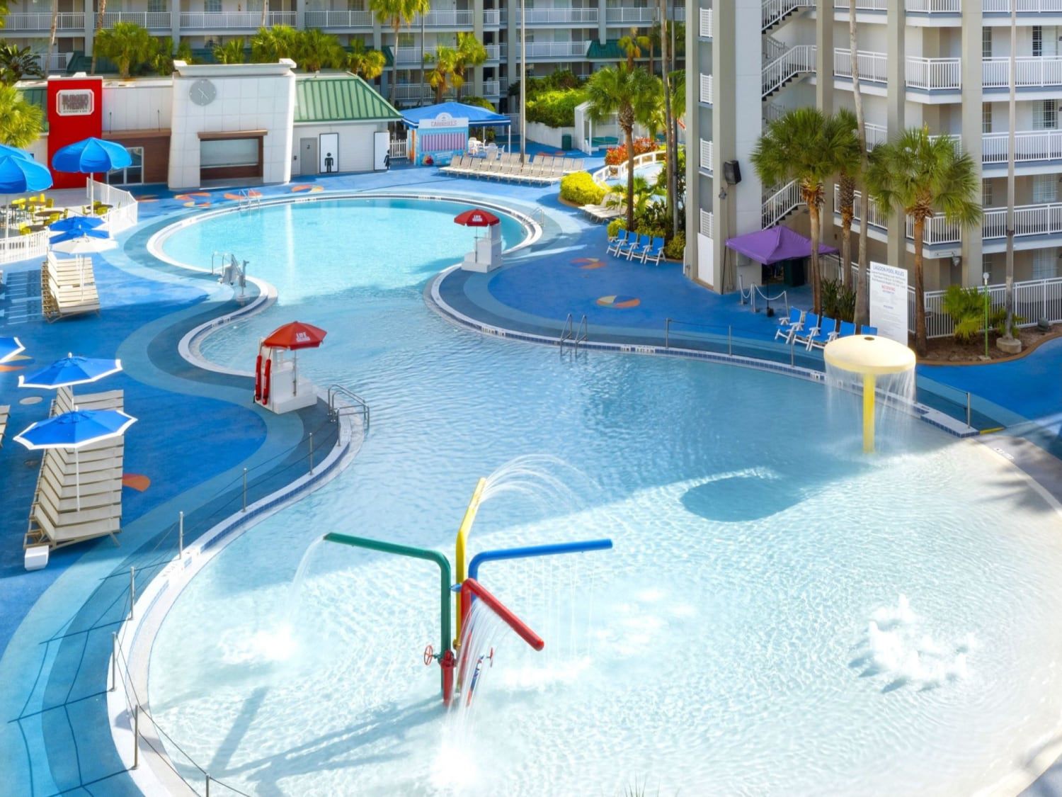 Aerial shot of resort pool with multiple water features and play areas