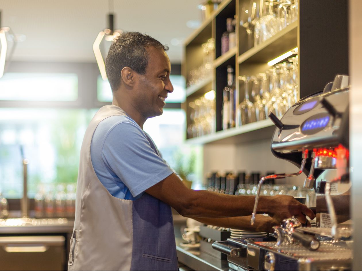 A Holiday Inn - the niu barista whipping up a warm coffee beverage