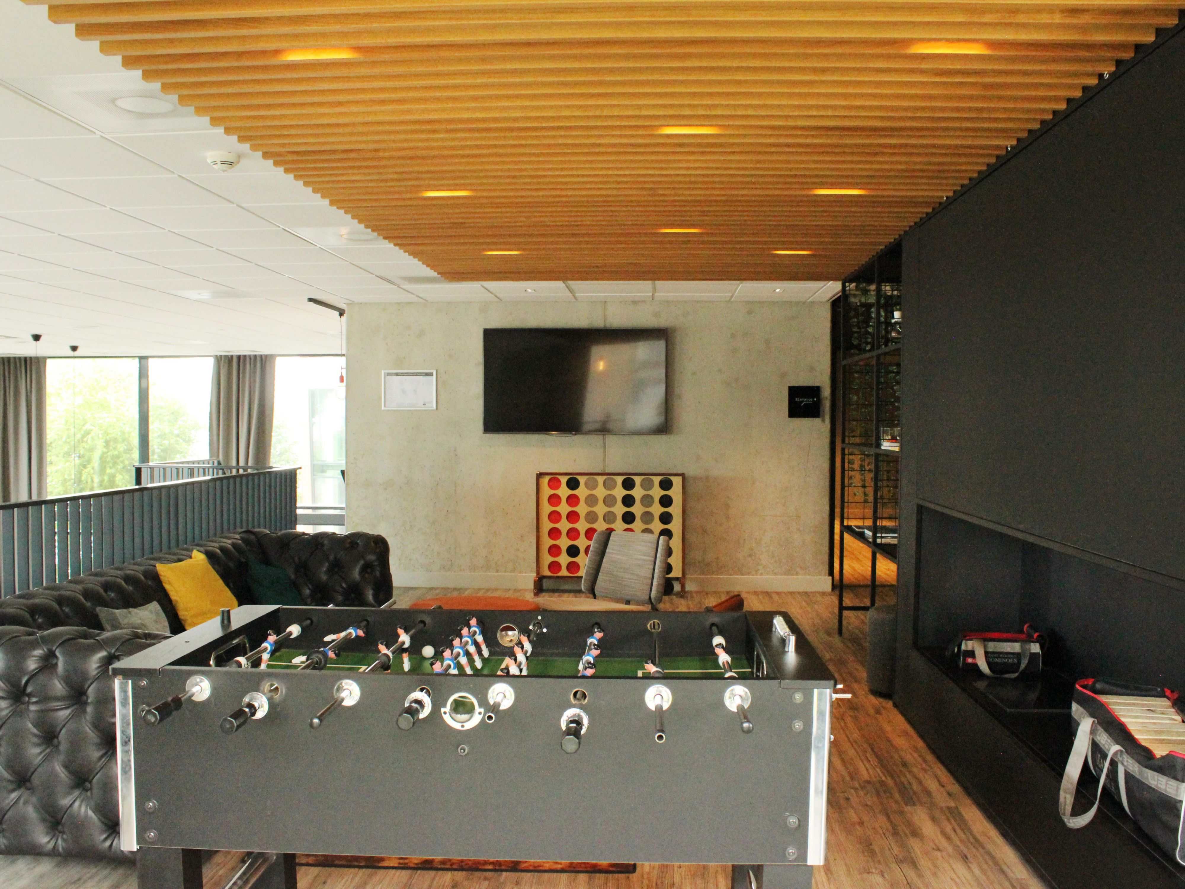Our gaming corner with giant Connect Four and foosball awaits