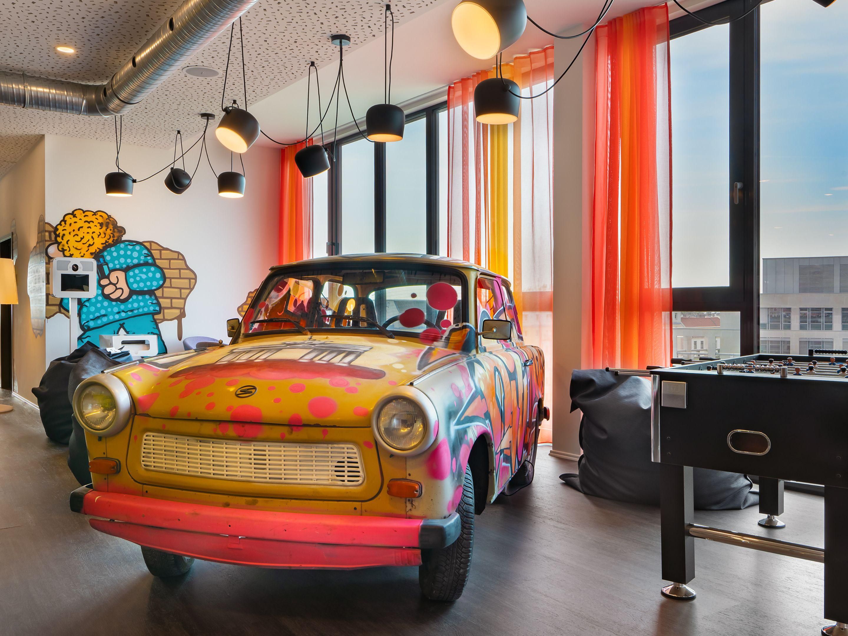 The German street art combo Gigi & Amando bring vibrant comic street art to our hotel. Always extravagant, always a little wild, the duo transforms walls into explosive visual playgrounds. Their colourful Berlin-inspired murals are playful, bold, and full of energy—art that makes you smile, stop, and look twice.