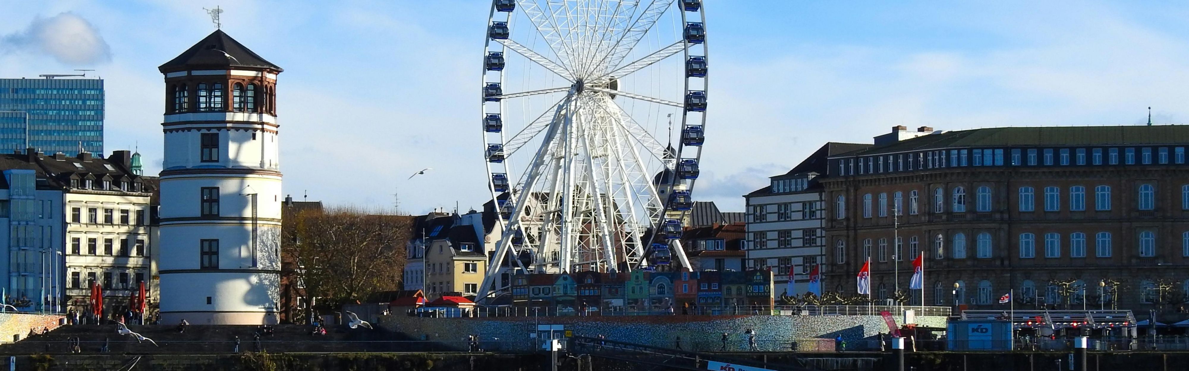 Castle Tower and Ferris Wheel at Burgplatz in Düsseldorf.