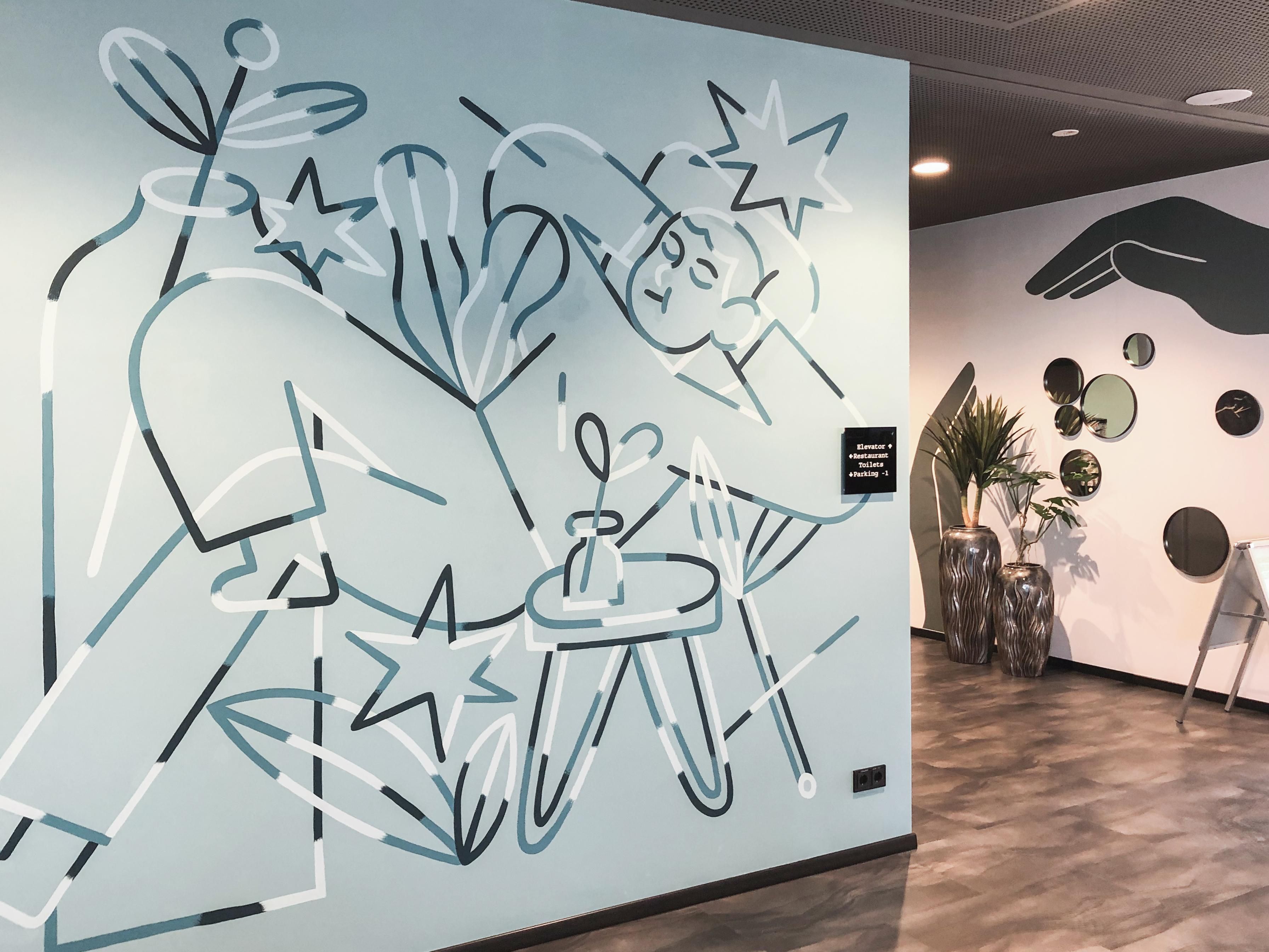 At Holiday Inn -  the niu,  Cure, Erlangen’s medical heritage meets creative expression. Warm pine green accents, soft lighting and playful medical-inspired décor create a space full of character. Enjoy a relaxed stay, discover insider tips without a prescription at our counter and unwind in surroundings where art, and comfort blend effortlessly.