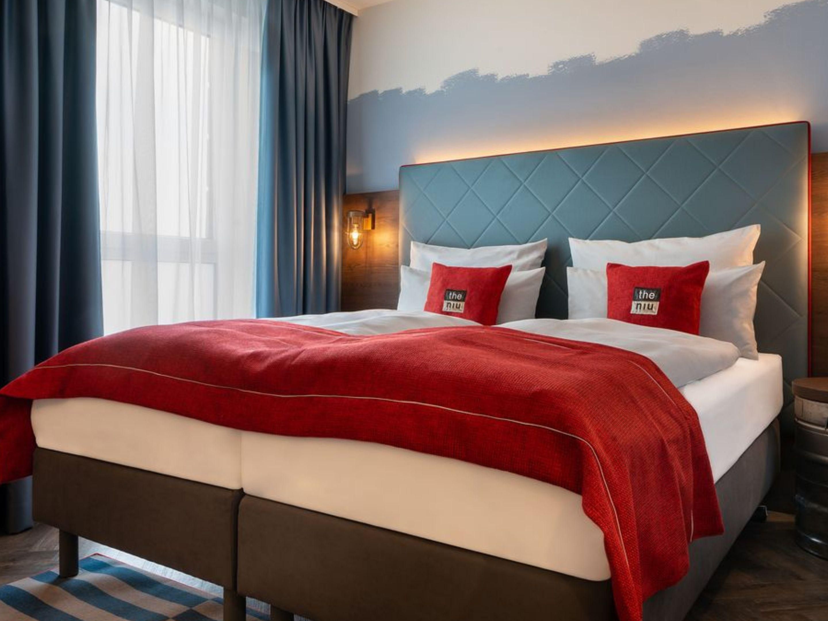 Feel at home and rest in our modern hotel rooms with a Queen bed
