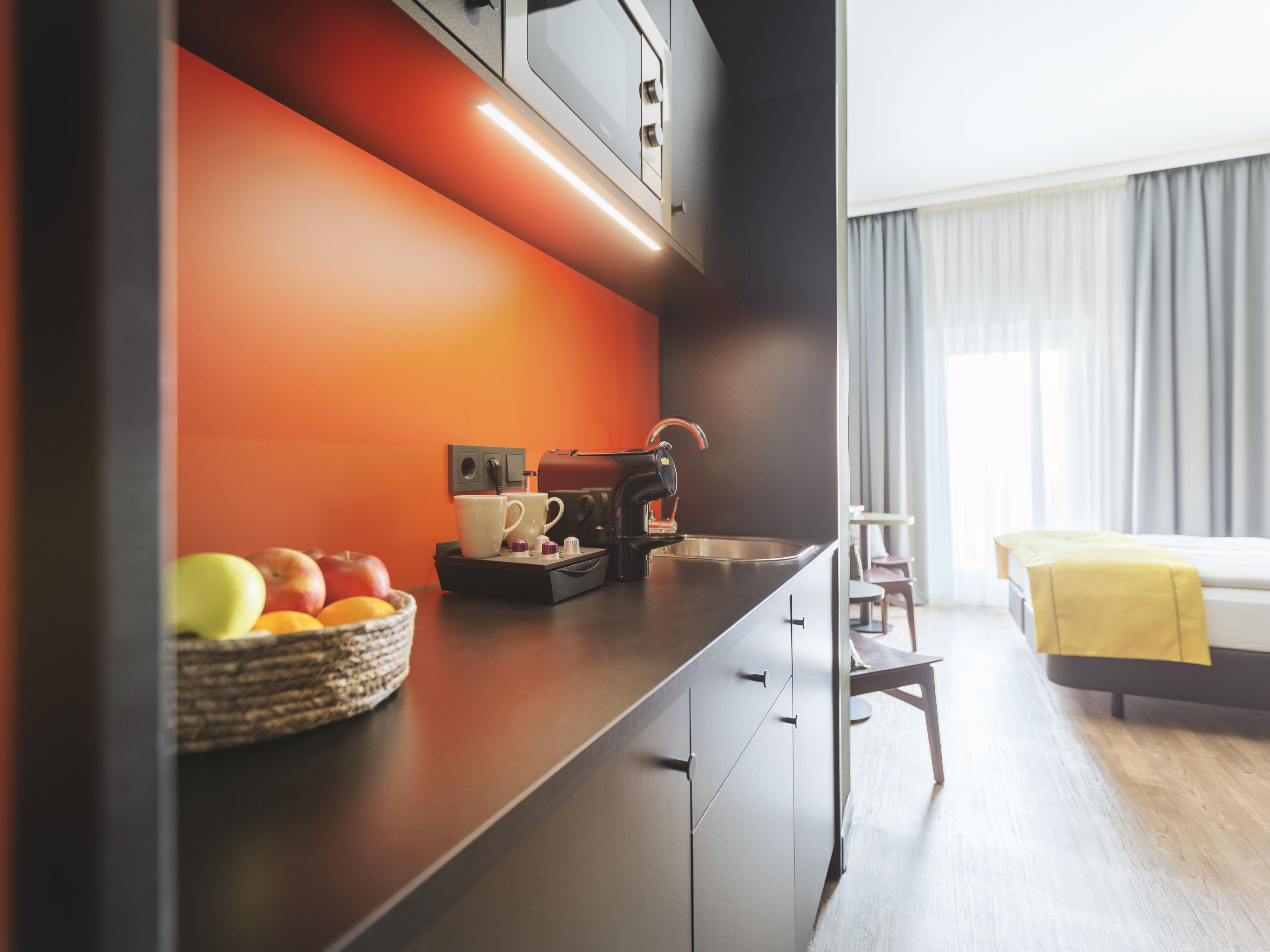 Enjoy more space and comfort with an upgrade to a Premium Room with kitchenette – now up to 50% off the supplement. Ideal for longer stays, families, or business trips: With a fridge, microwave, and coffee pod machine, you’ll feel right at home.