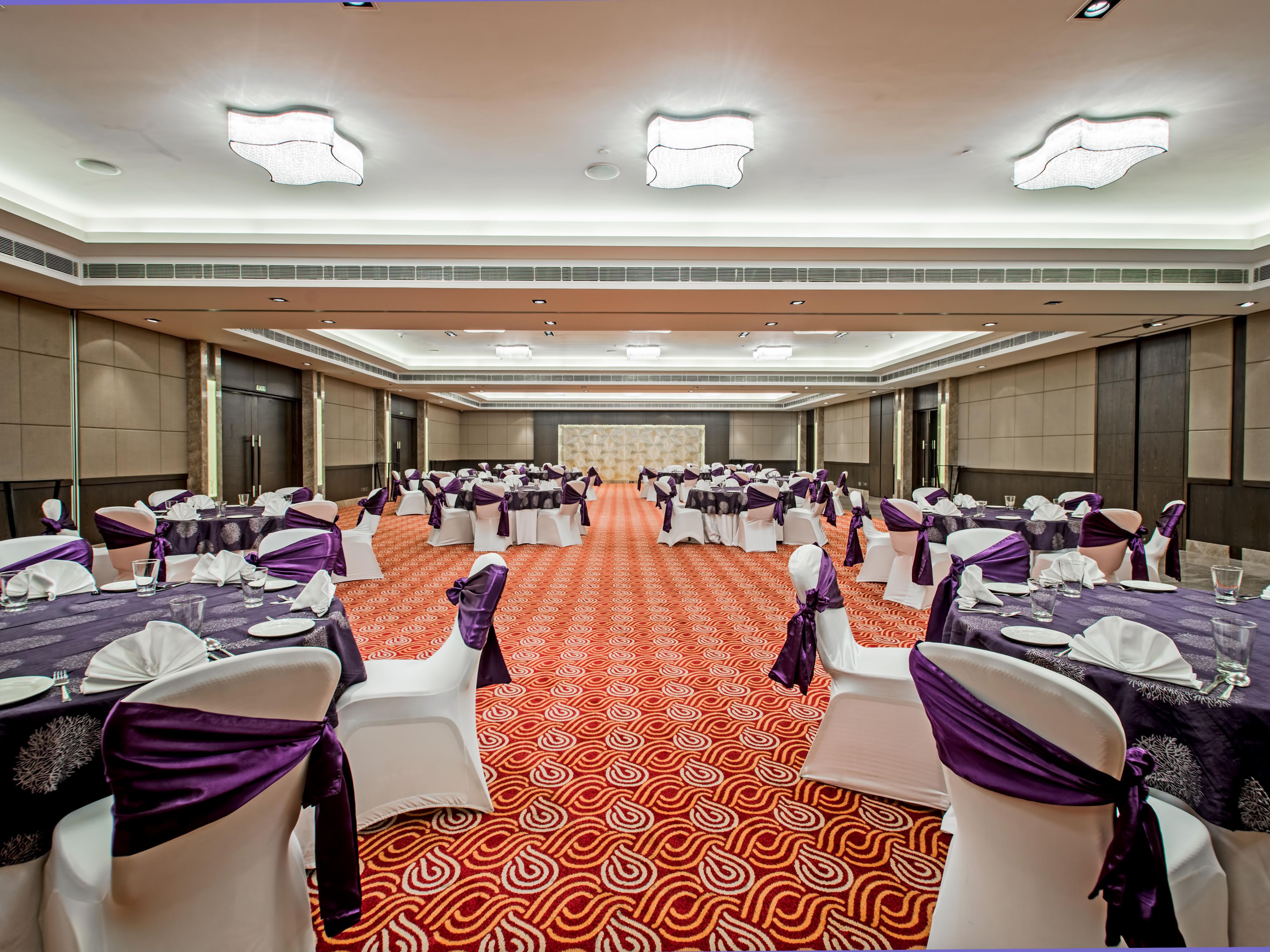 Over 10300 sq. ft. partible banqueting space with 3900 sq. ft. of lawn and 2100 sq. ft. pre-function area can accommodate 450 guests.