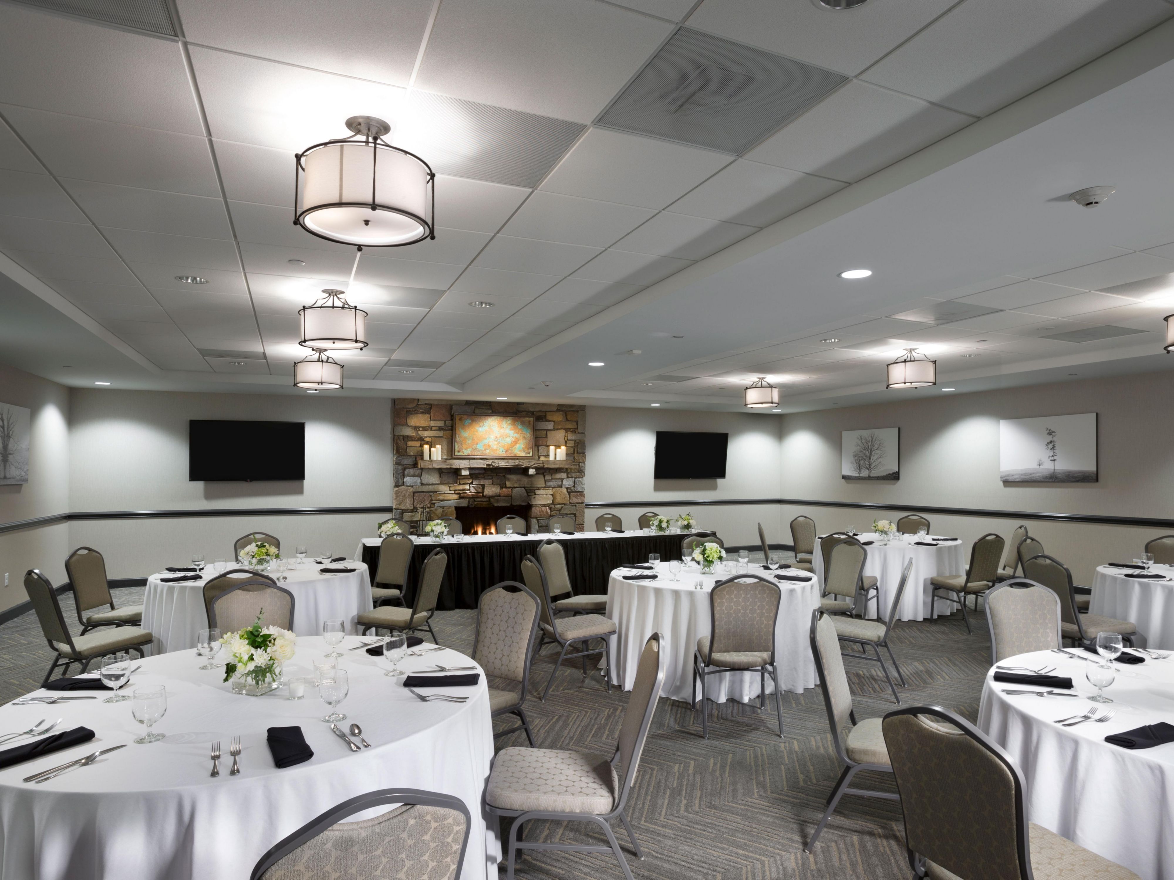 Host your next event with us in the Blue Ridge Room, featuring a working stone fireplace, 2 60" Smart TV's and all your AV needs. Whether you're hosting an intimate business meeting or extravagant celebration we have the space you need.  Contact Emily or Casey in our Sales Department to get started! 828.298.5611 or sales@holidayinneast.com.
