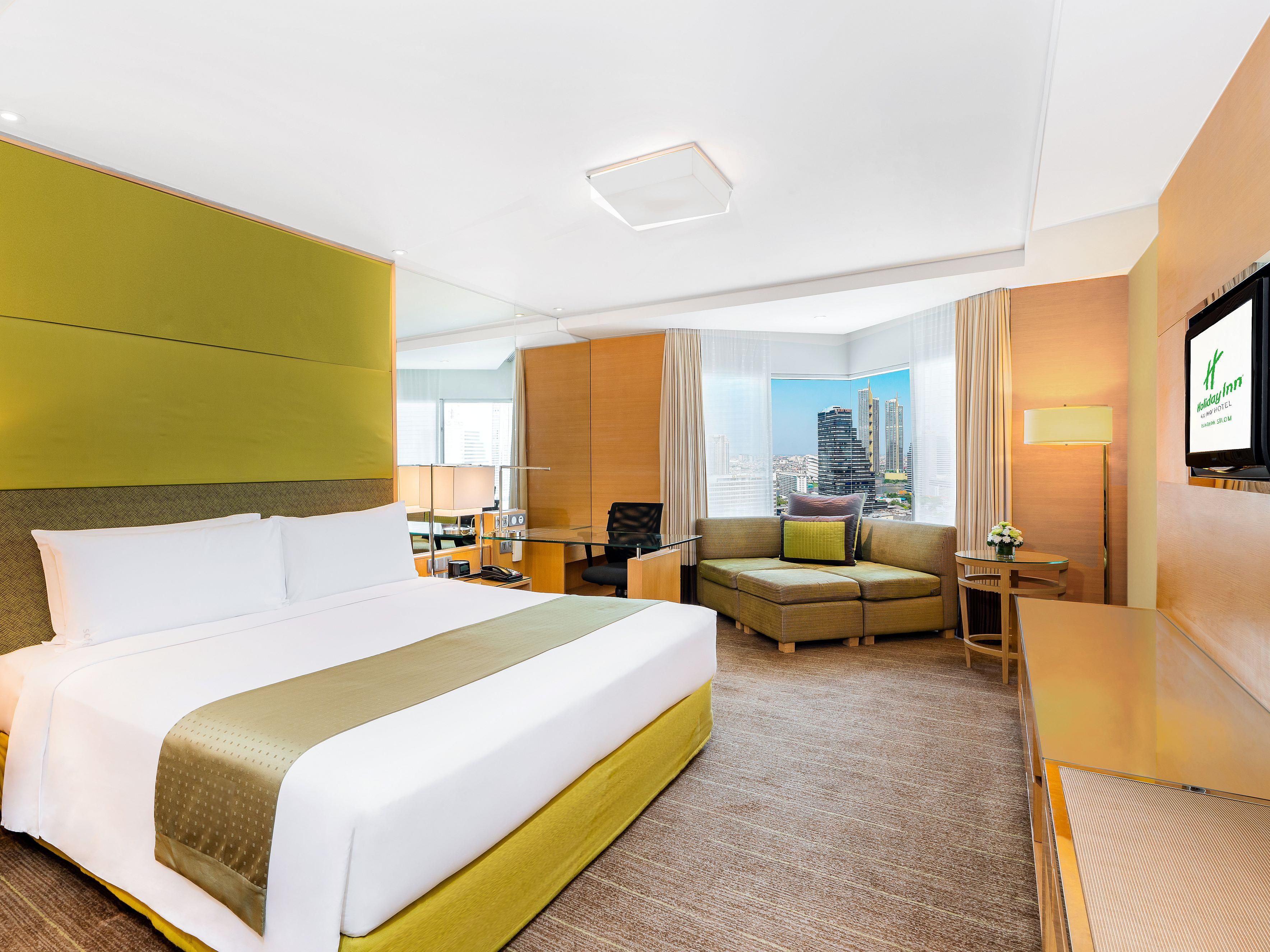 With 684 rooms, Holiday Inn Bangkok Silom stands as the largest hotel in the Silom Area, offering a remarkable blend of scale and sophistication. Step into a world where spacious guest rooms boast chic designs, high-speed Internet ensures connectivity, and every detail is curated to enhance your stay in the heart of Bangkok.
