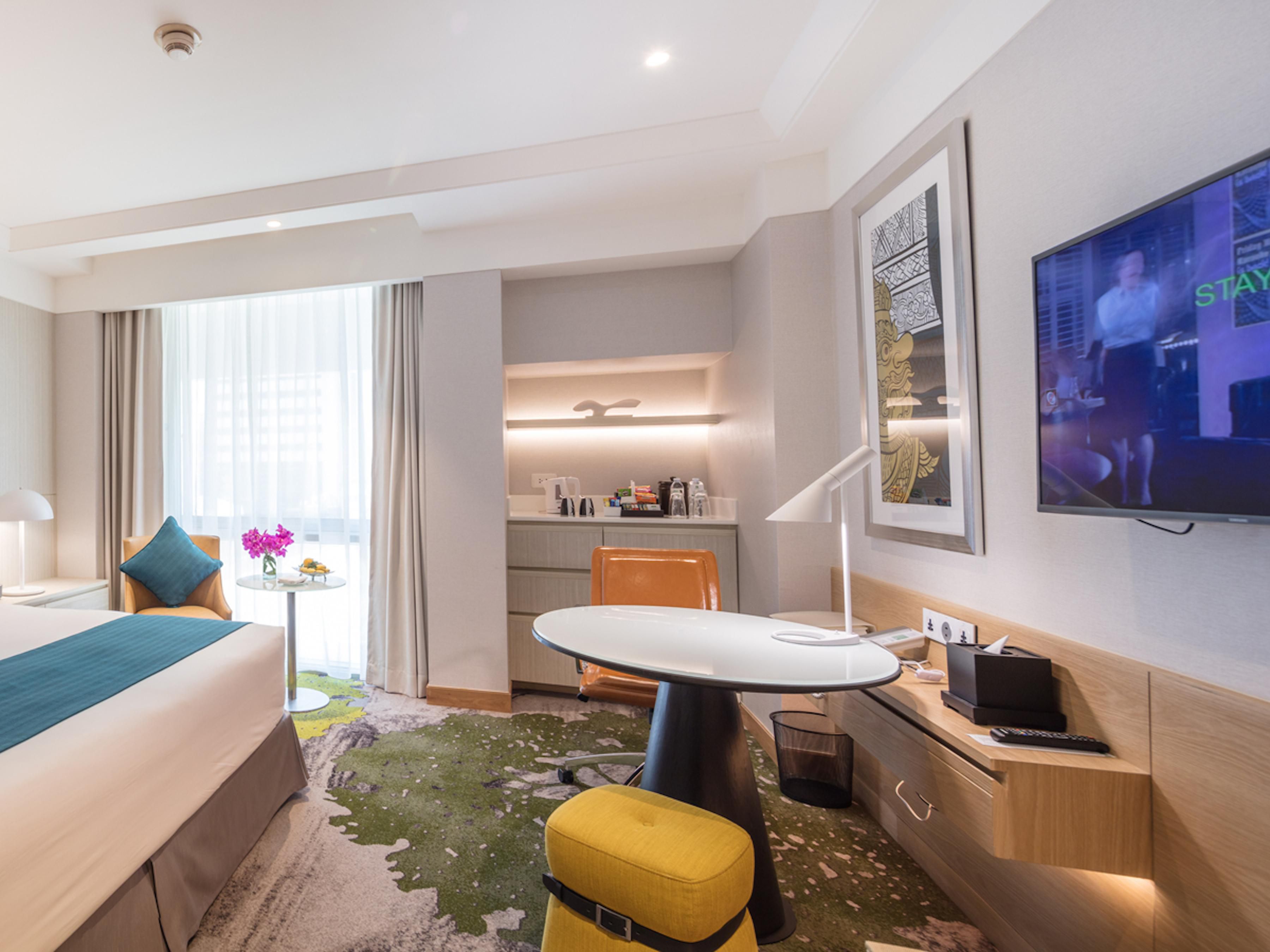 Our rooms come fully equipped with all the essentials for your comfort, including a coffee maker, hair dryer, in-room safe, TV, bath amenities, Wi-Fi, air conditioning, and a dedicated workspace. Room service is also available to ensure a convenient and relaxing stay.