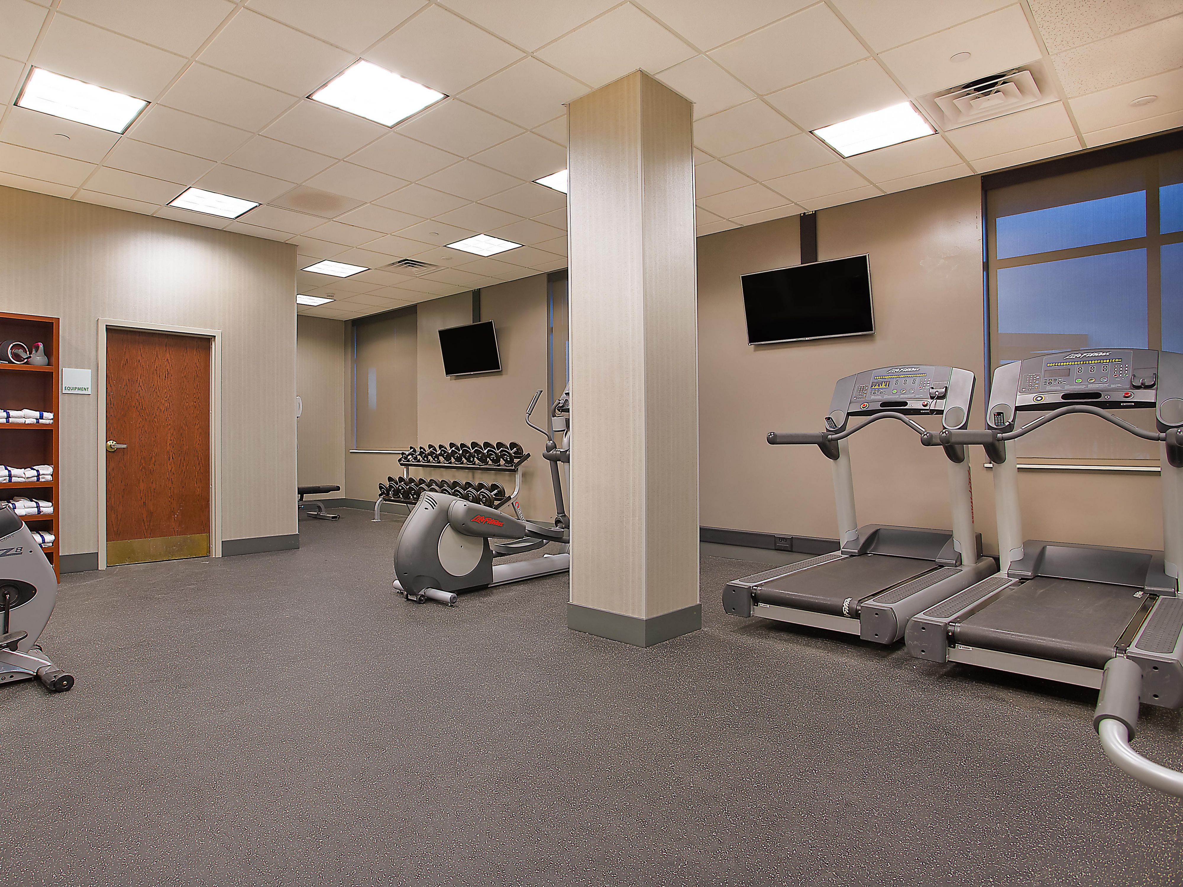 fitness center with cardio equipment