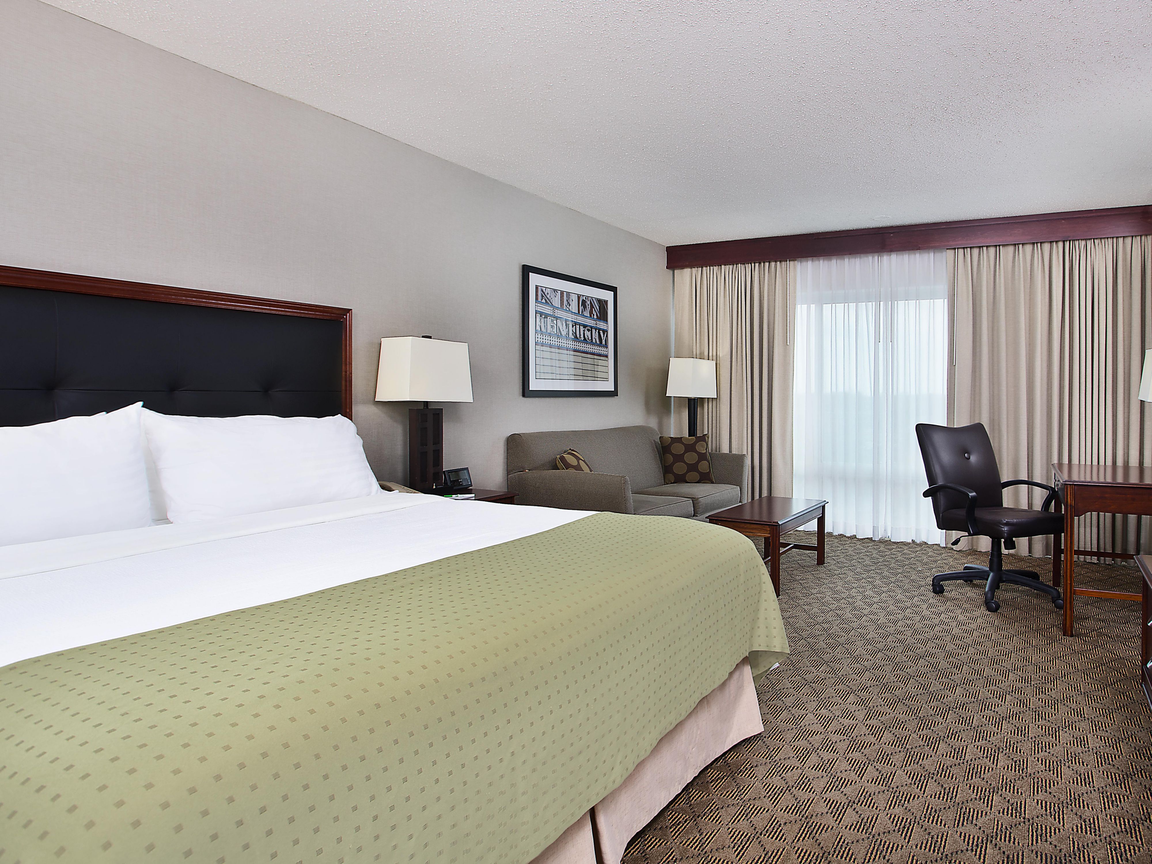 Relax in 218 spacious rooms and suites in Bowling Green. Opening to our atrium lobby and waterfall, our rooms offer premium beds, free Wi-Fi, a spacious workspace, mini fridge, microwave, and a wet bar. Indulge in our one-bedroom suites with living and dining areas.