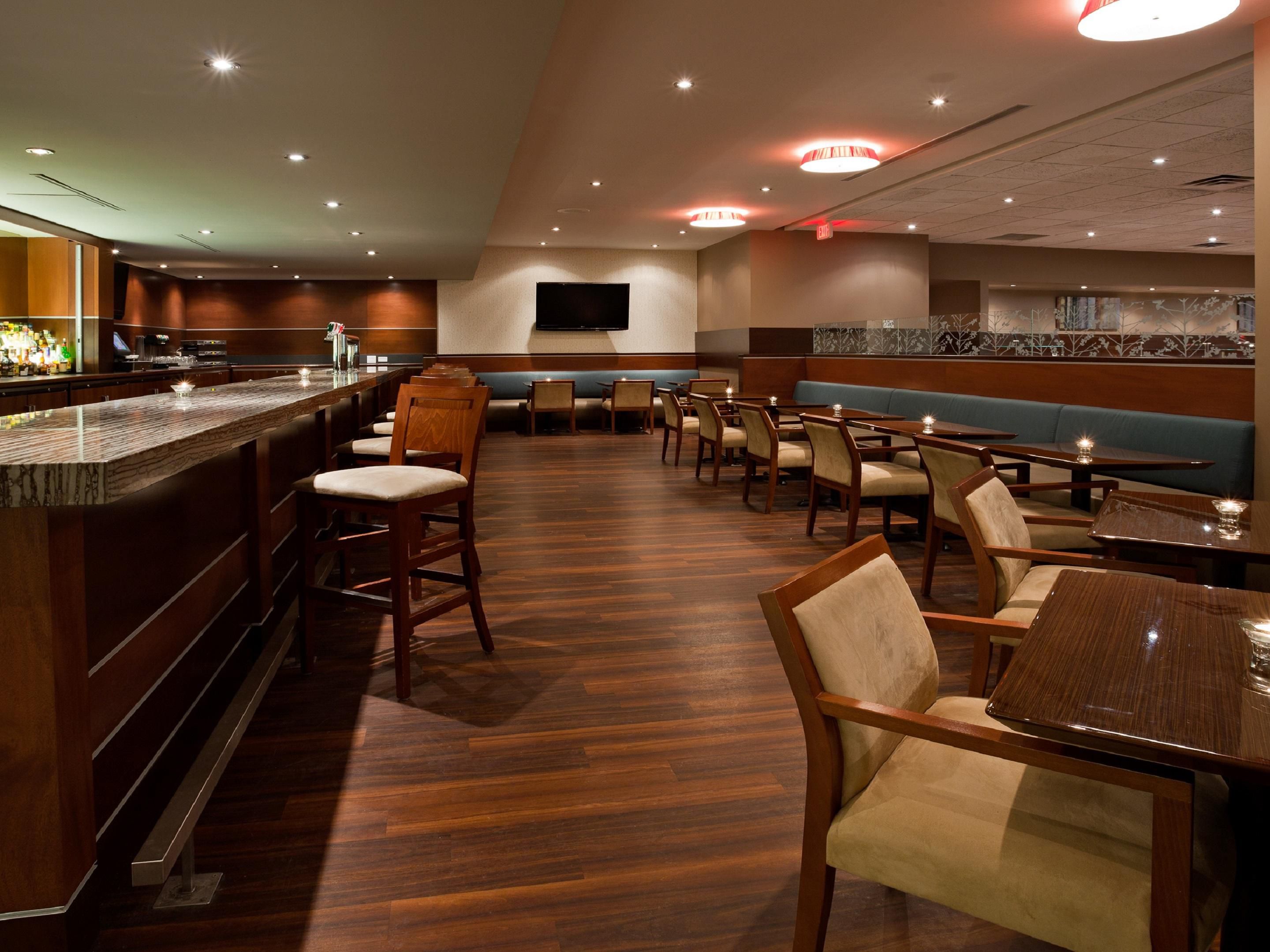 There's no need to venture outside the hotel when a warm welcome awaits you in Alloro Bar. Take a seat at our gleaming 30 foot quartz bar featuring 3 big screen TV's so you can catch all the action of your favorite sporting event