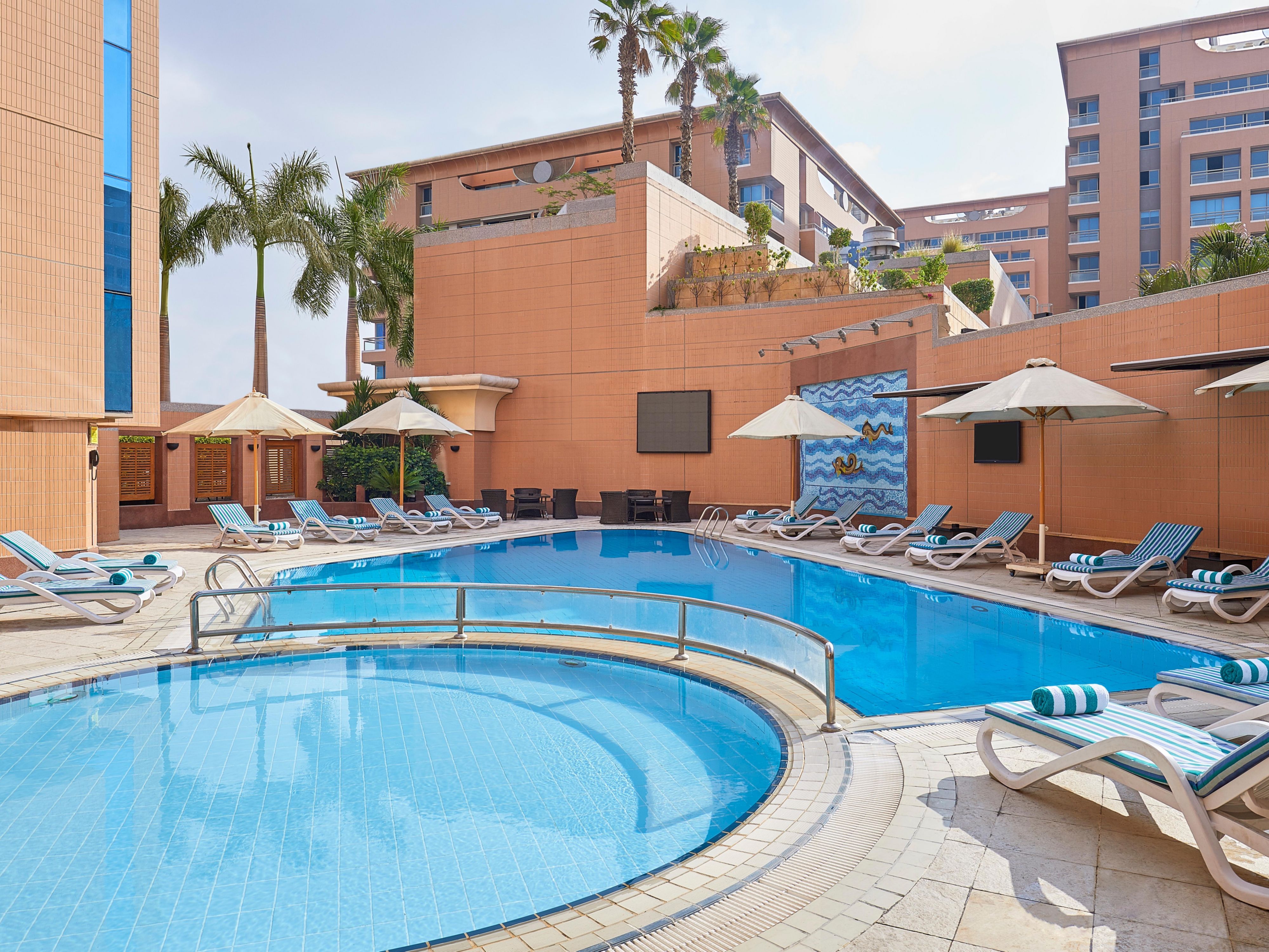 Relax by the outdoor temperature controlled swimming pool