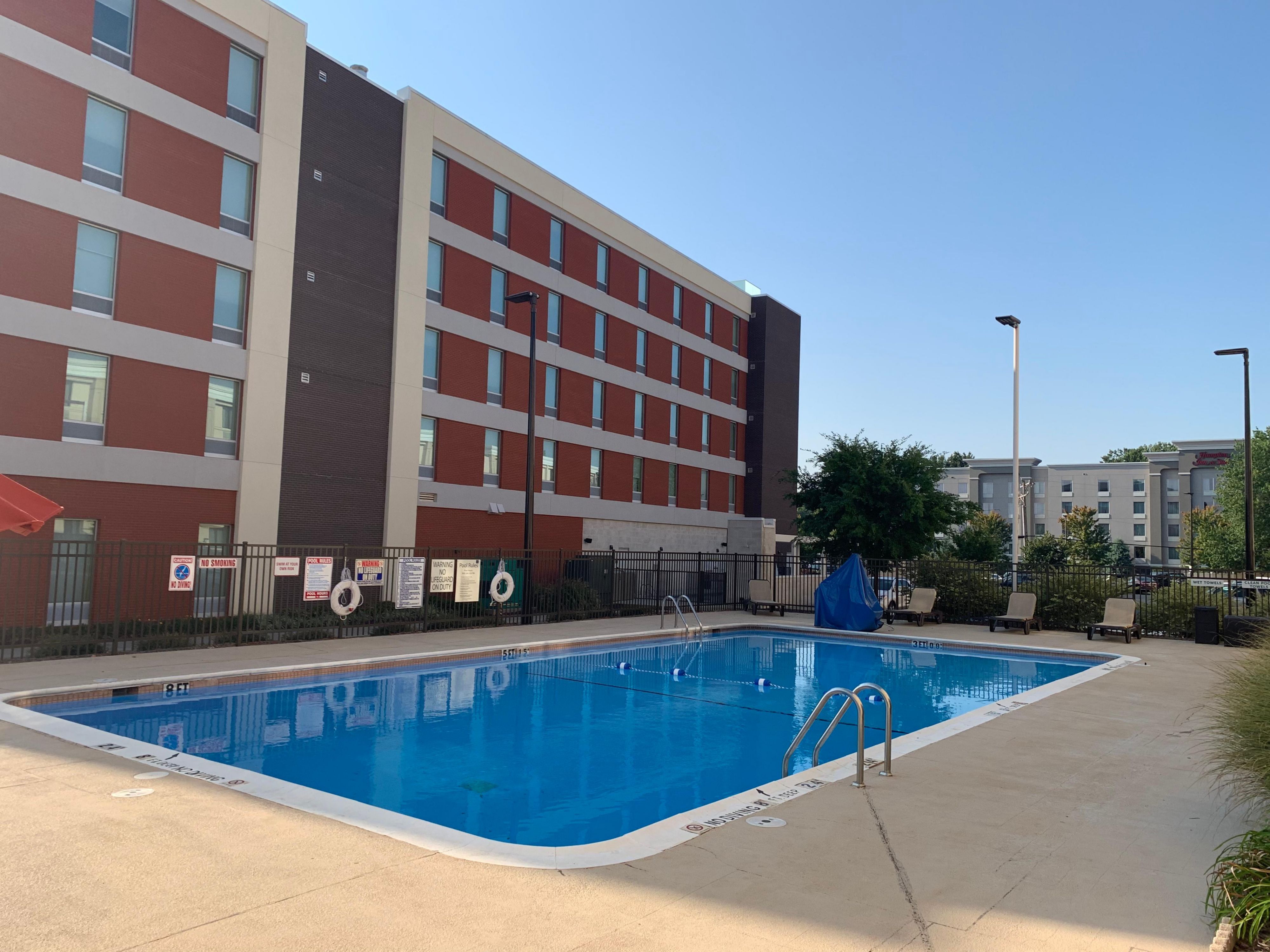 Seasonal Outdoor Pool with Lounge Chairs & Umbrellas