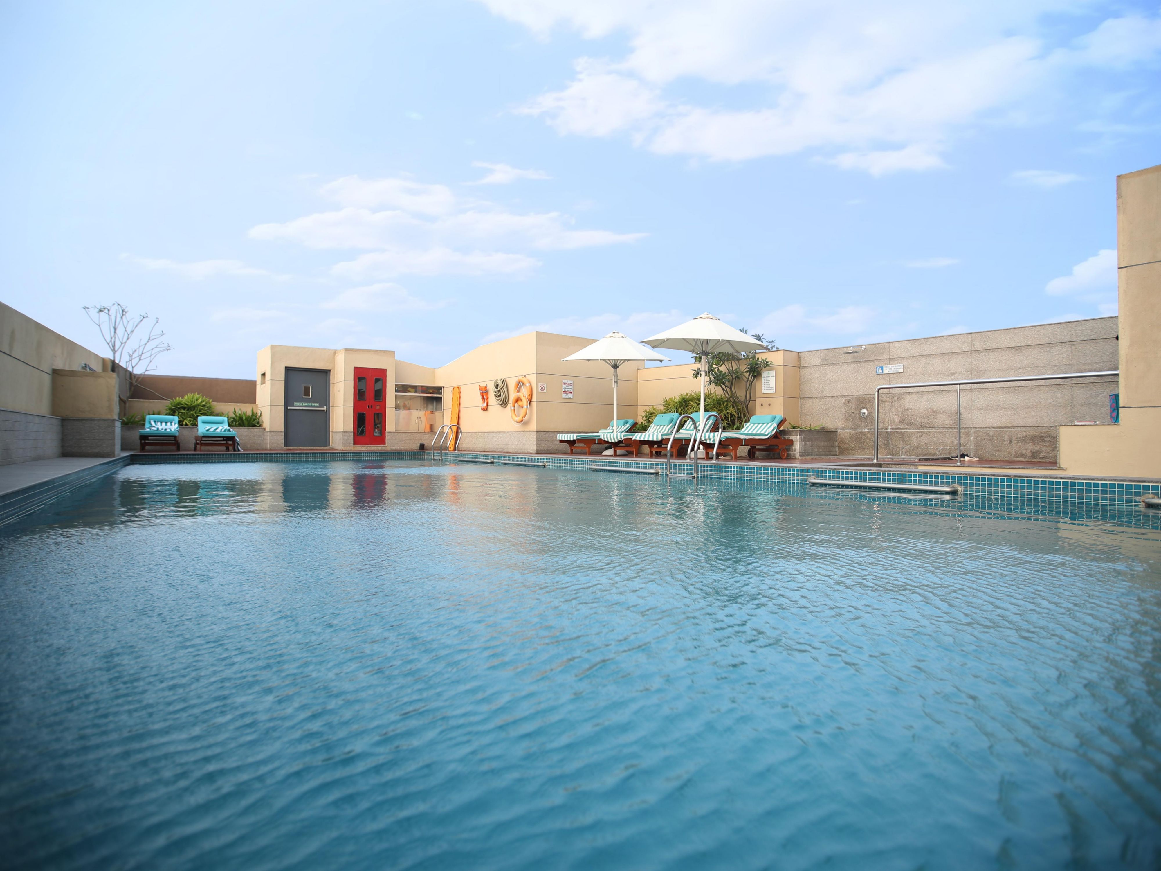 The outdoor pool offers a serene oasis for relaxation and recreation in Chennai. Dive into the crystal-clear waters, soak up the sun on comfortable loungers, and enjoy a refreshing escape from the bustling city. It's the perfect place to unwind and rejuvenate during your stay at Holiday Inn Chennai OMR.