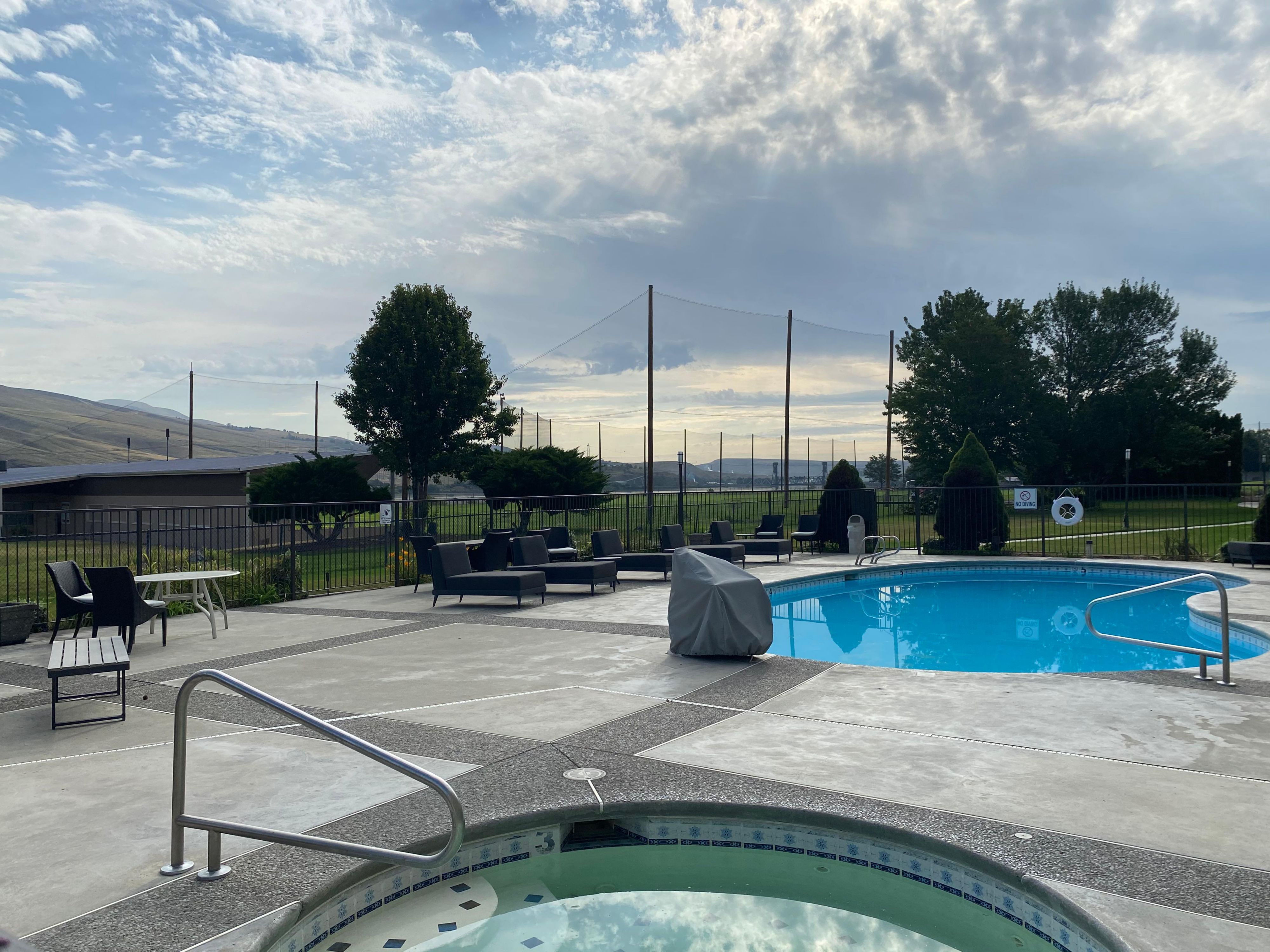 Relax and rejuvenate in our outdoor heated pool and hot tub, perfect for unwinding after a long day of exploring. Whether you're looking to swim a few laps or simply soak and enjoy the scenery of our Pacific Northwest setting, our pool area offers a peaceful retreat with charming views and comfortable lounging areas.