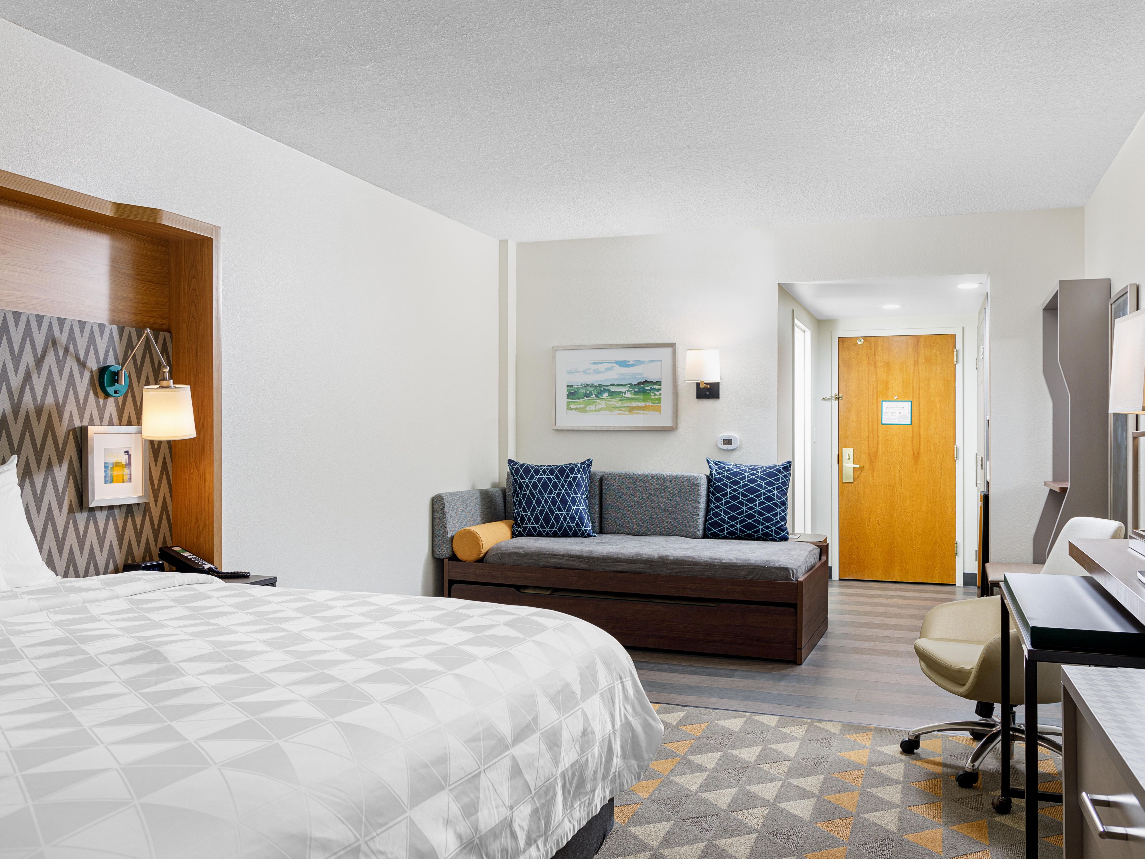 Characters: Unwind in spacious rooms designed for comfort and productivity. Enjoy premium bedding and bath amenities, ample workspace, and free Wi-Fi. From a mini fridge and microwave to a coffee maker and free Wi-Fi, we ensure you have everything you need for a relaxing and productive stay.