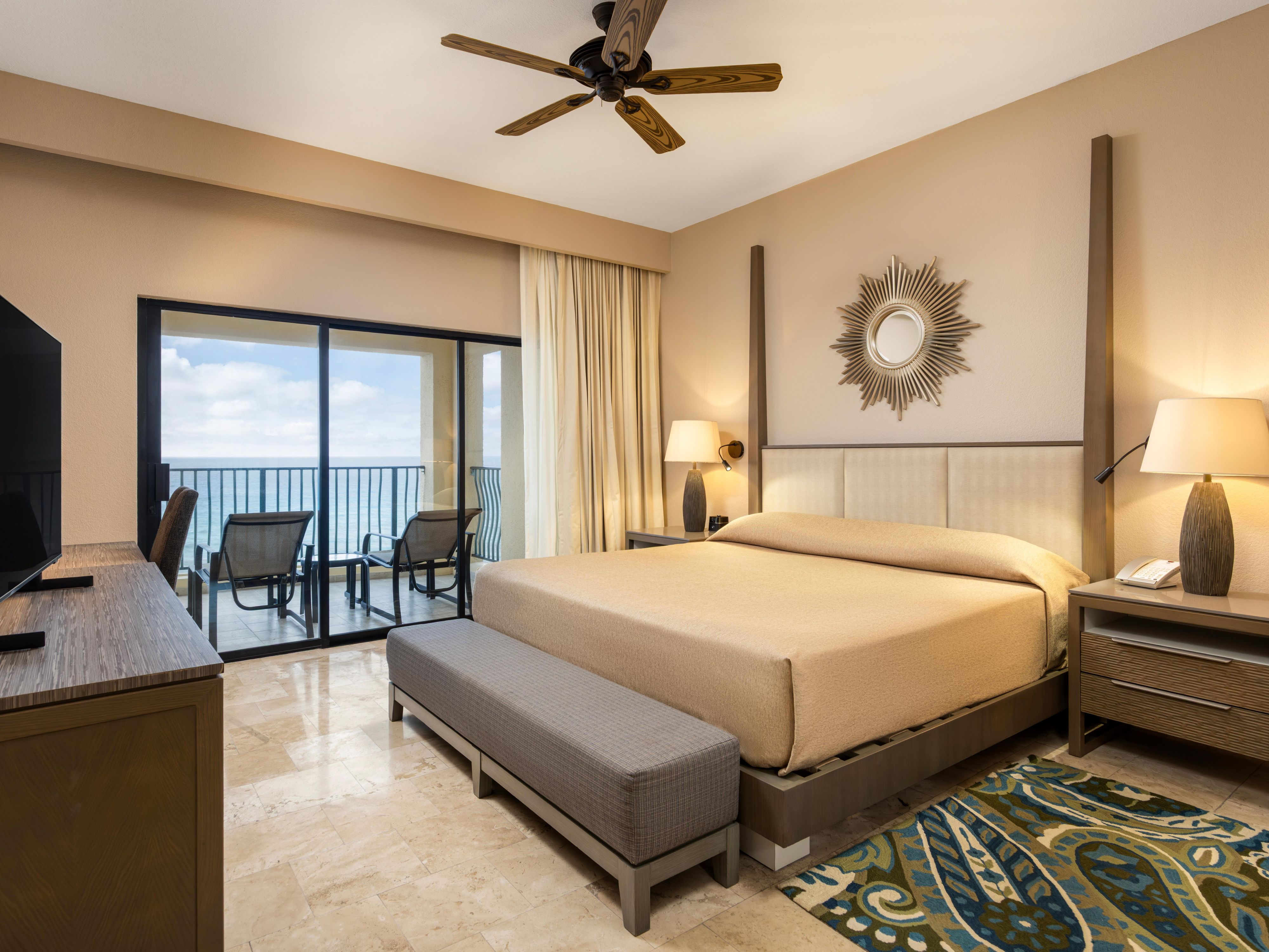 Peaceful master bedroom with ocean views and modern décor.