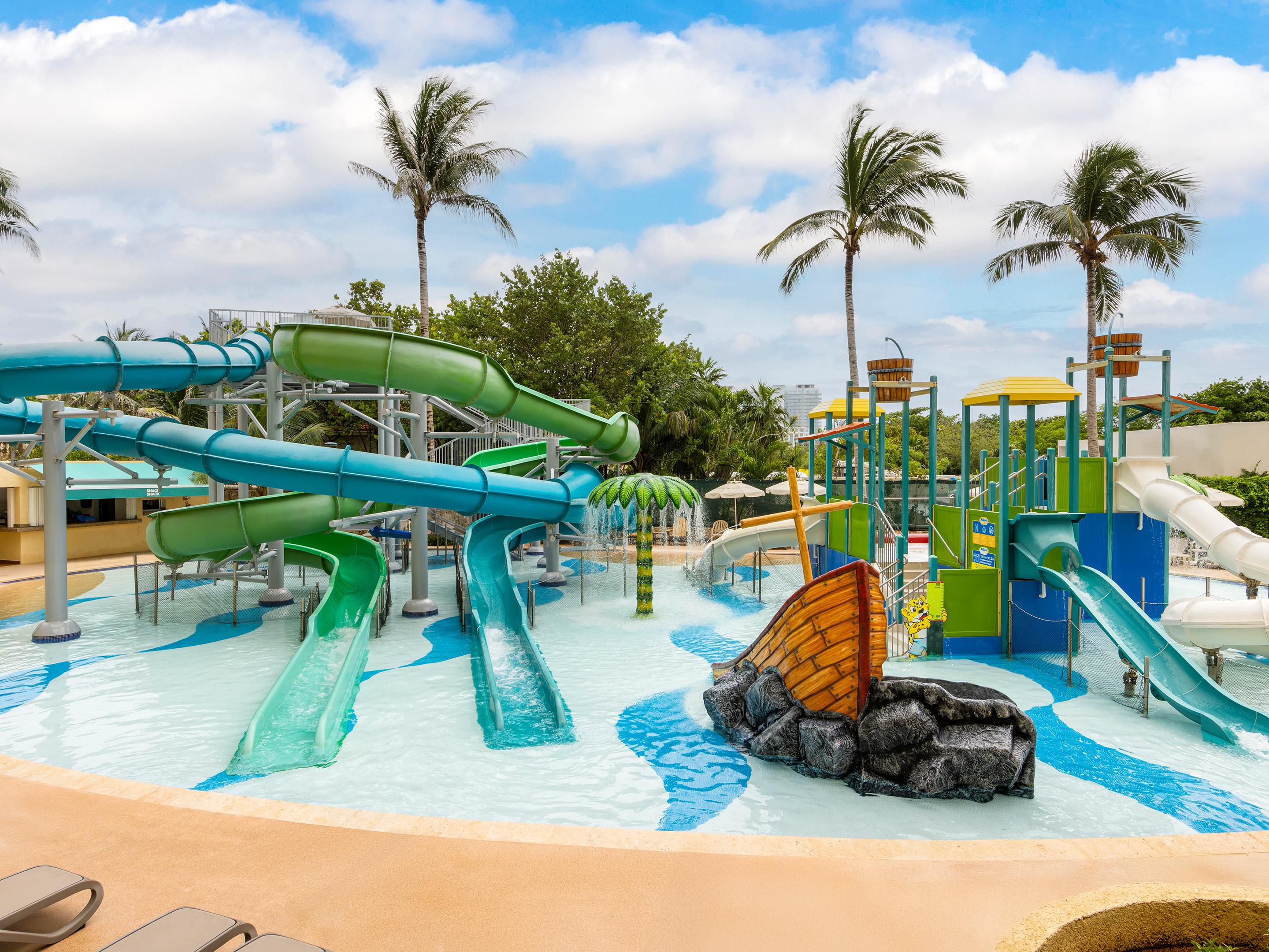 Family-friendly water park with colorful slides and shallow pool.