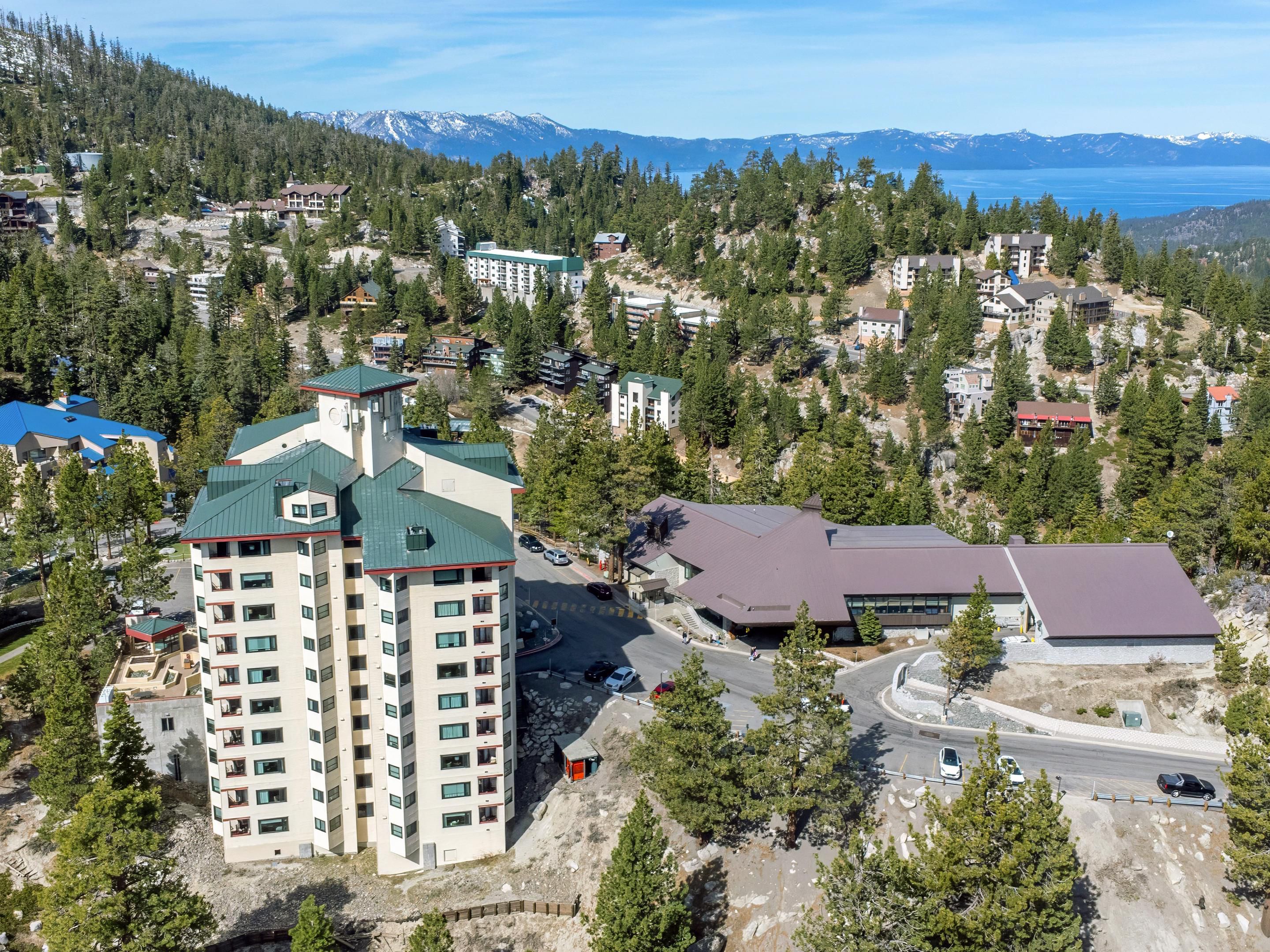 Tahoe Ridge Resort above forested slopes and Lake Tahoe.