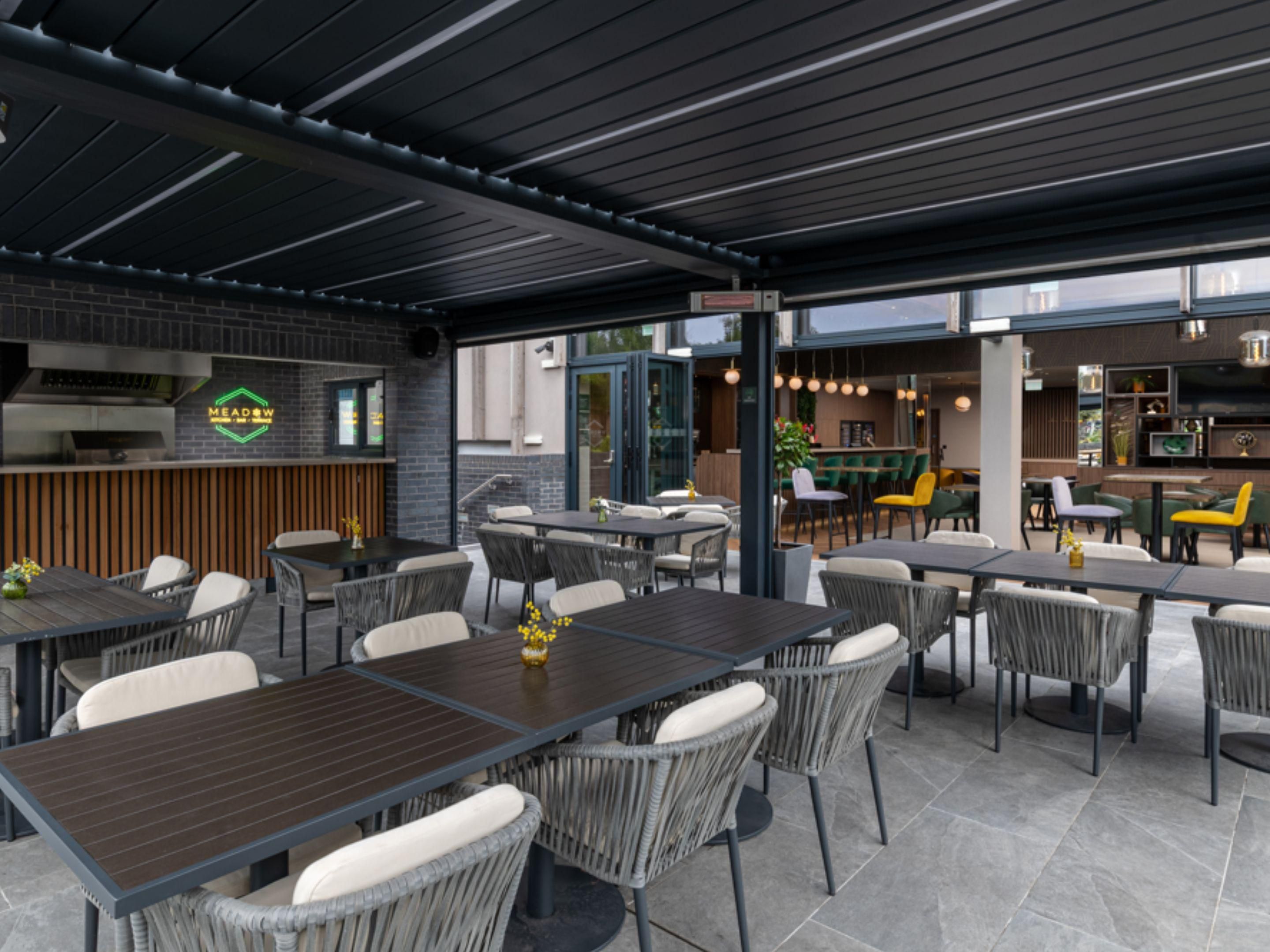 Step through the bi-folding doors from our bar to our sun-soaked terrace, the perfect spot to relax on a warm day. Enjoy a drink or some alfresco dining while soaking up the sunshine. In summer, we fire up our BBQ and pizza oven, serving delicious pizzas and grilled dishes. Whether you're a hotel guest or a local, everyone is welcome!