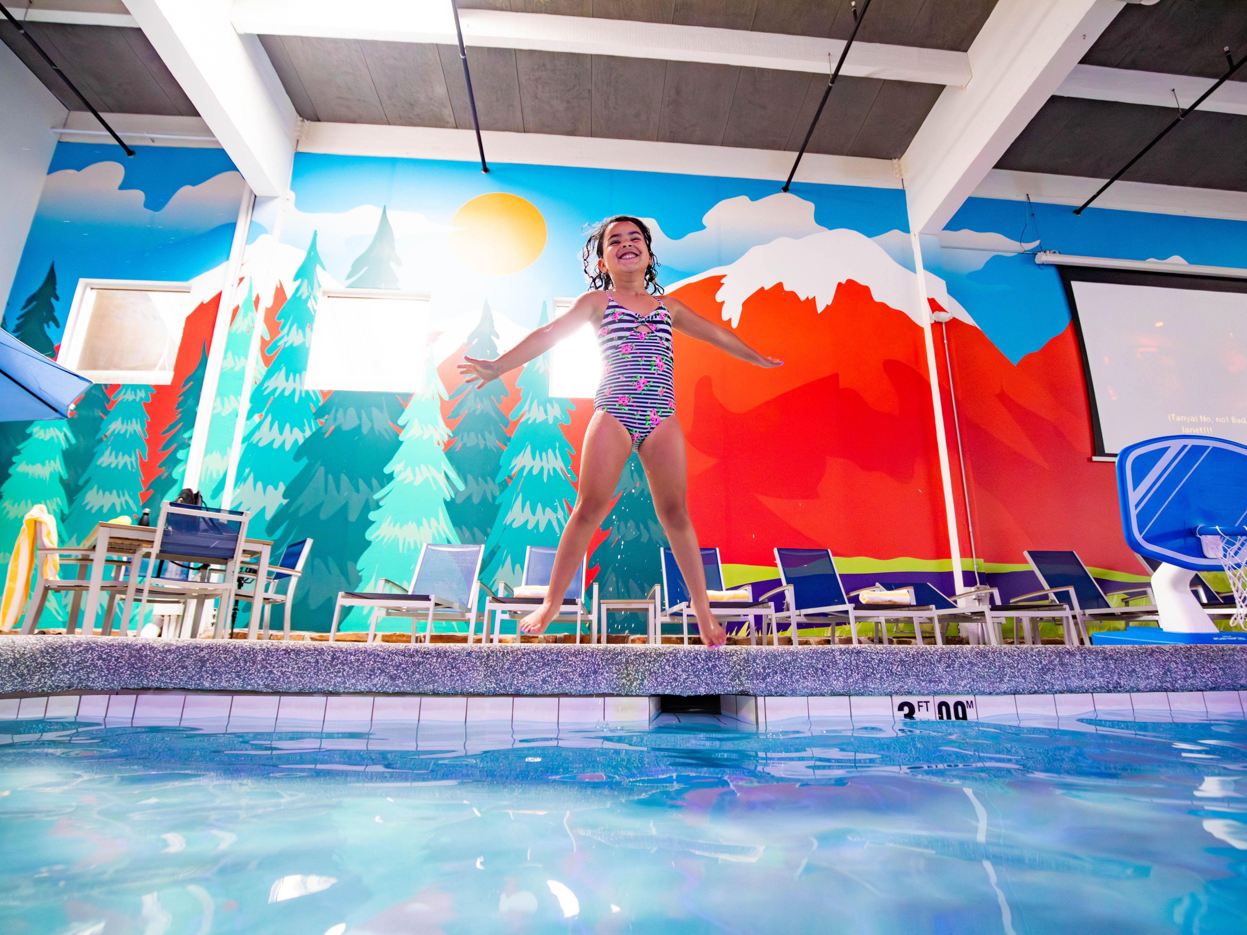 After a day of exploring, relax and rejuvenate in our indoor heated pool and soothing hot tub. Enjoy a dive-in movie experience with our 180-inch projector screen showcasing family-friendly movies and the excitement of Monday Night Football. Discover the perfect blend of aquatic and cinematic fun!