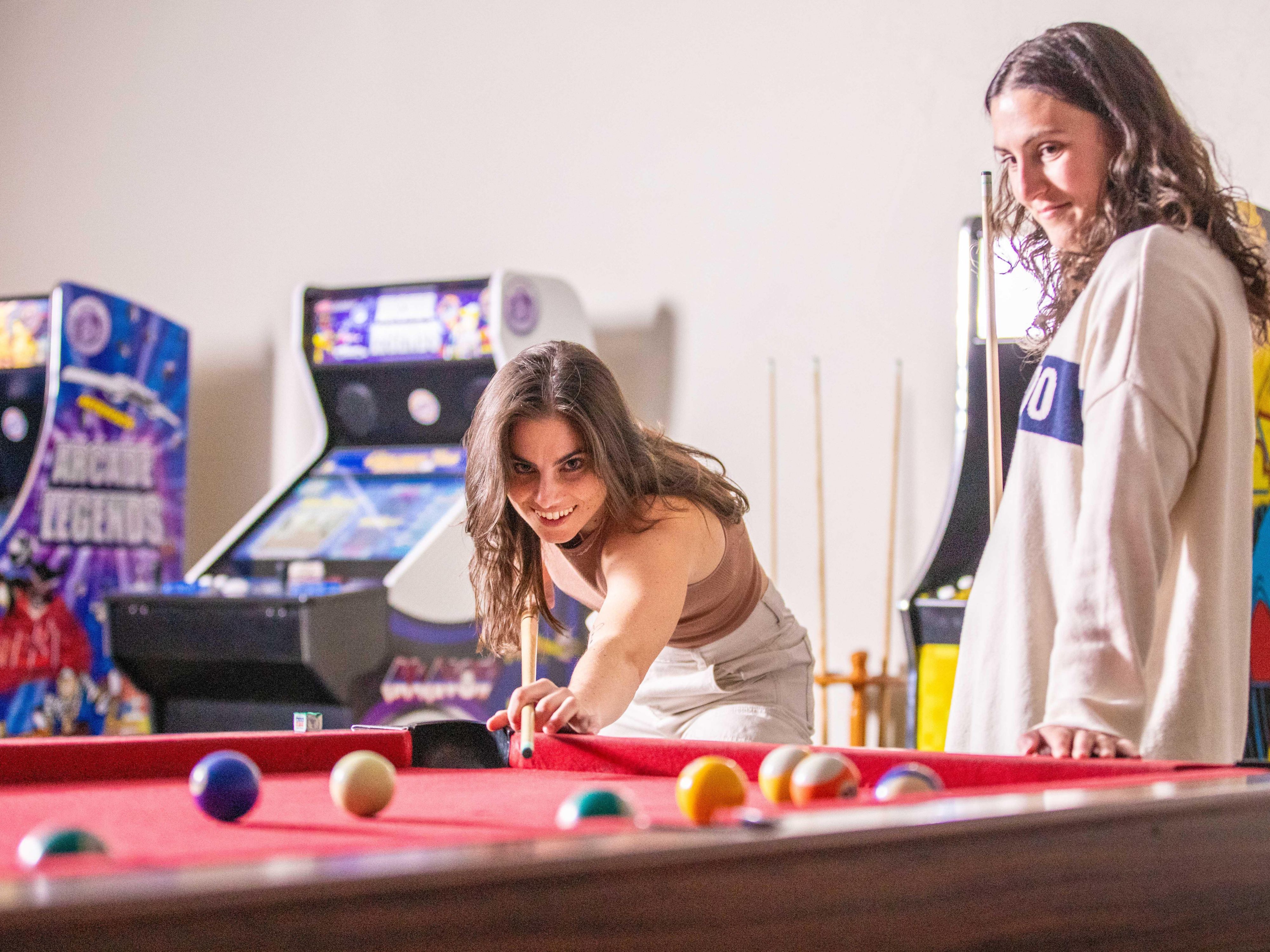 Playing a game of pool in the game room