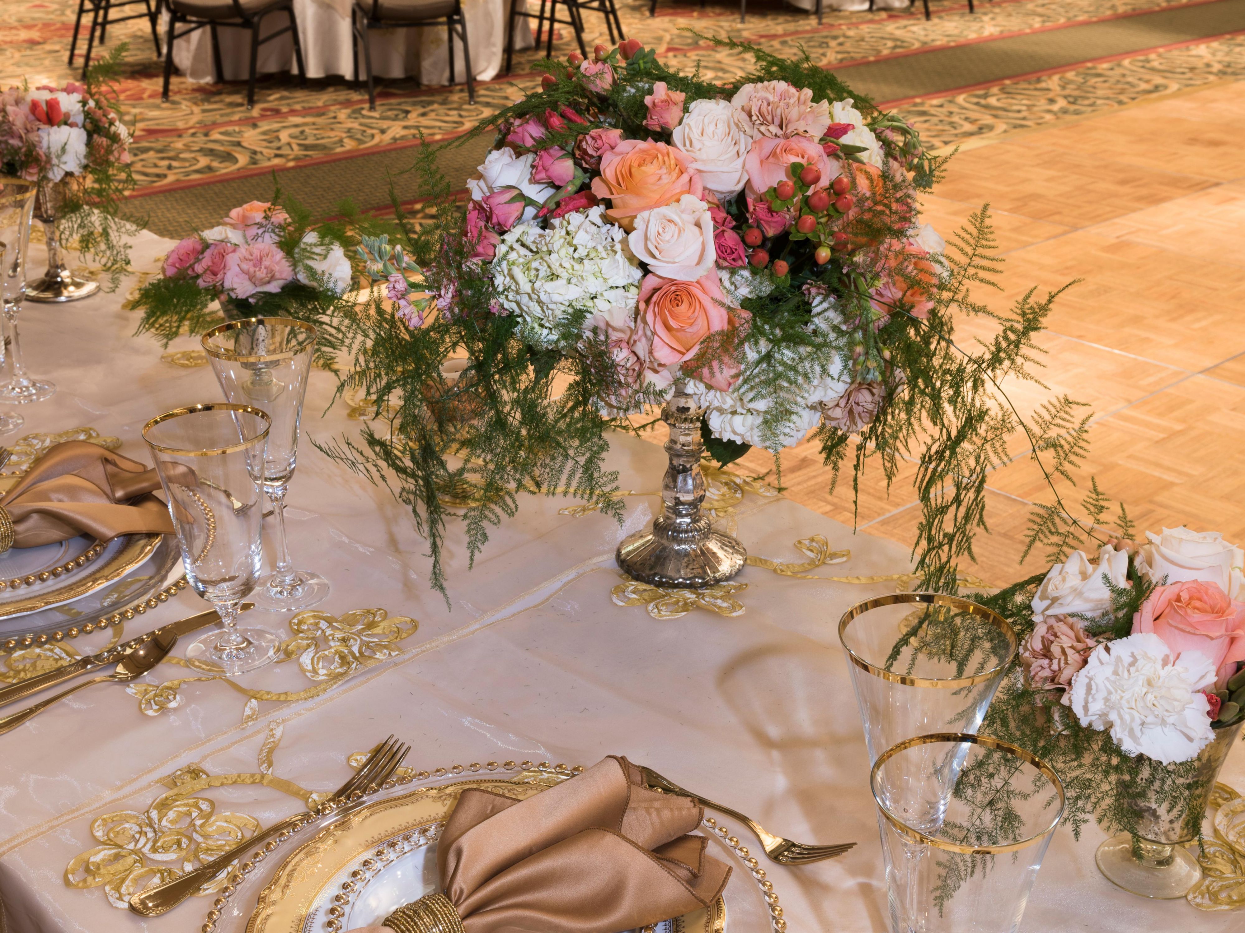 Table setup with wedding bouquet and silverware