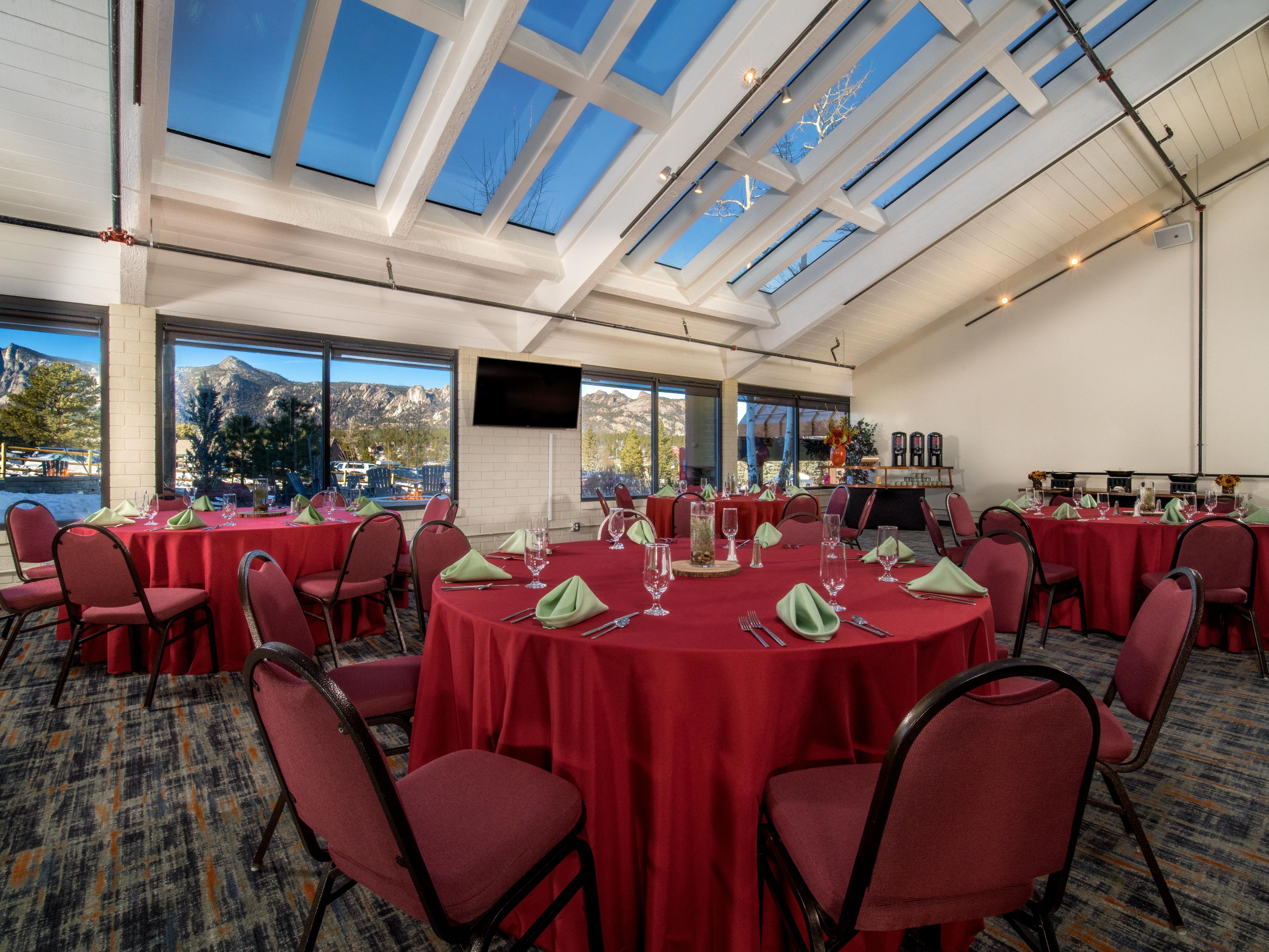 Holiday event with table cloths and floor to ceiling windows